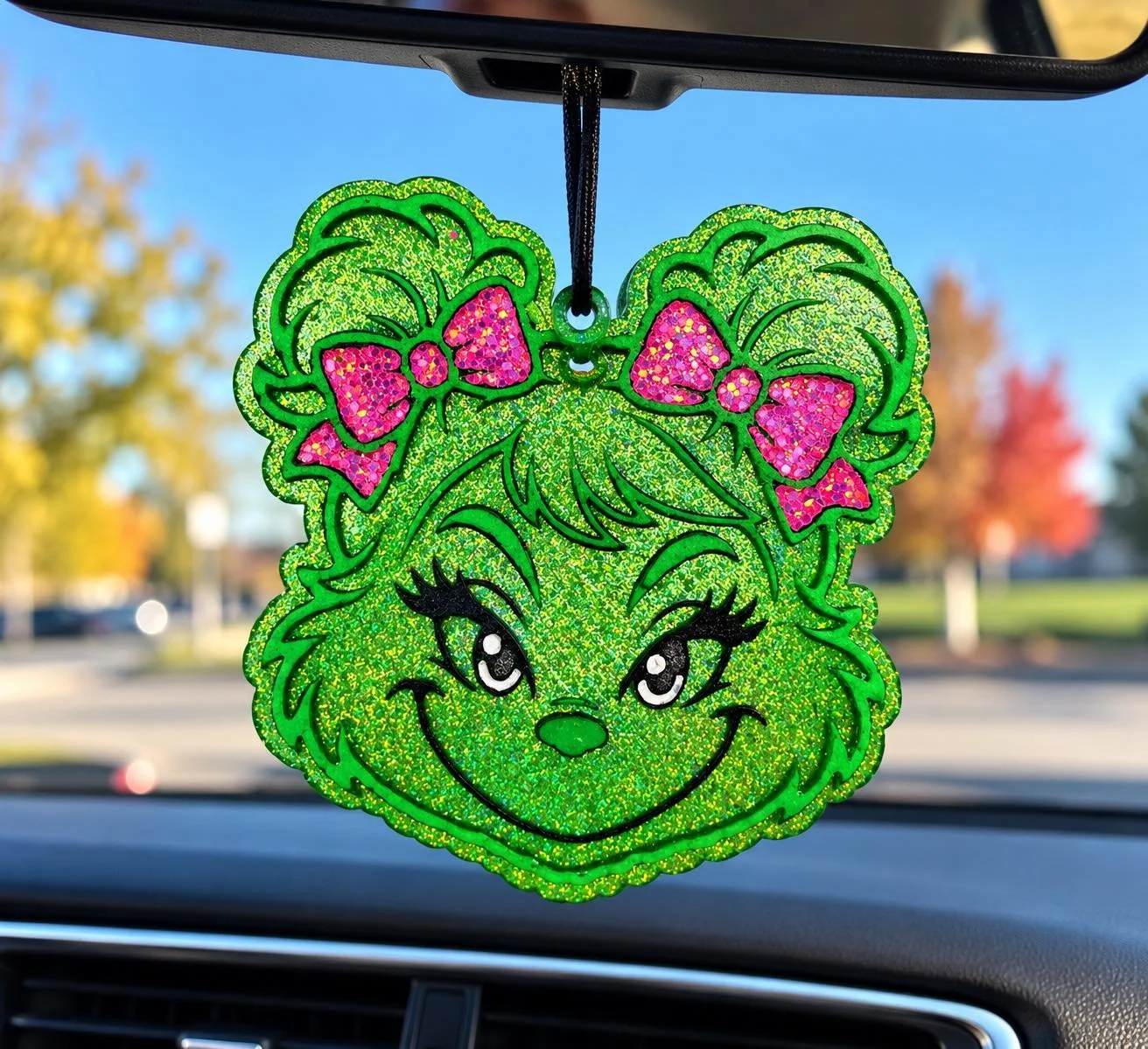 Girl Grinch car air freshener (freshie) with pink bows hanging from a car rearview mirror