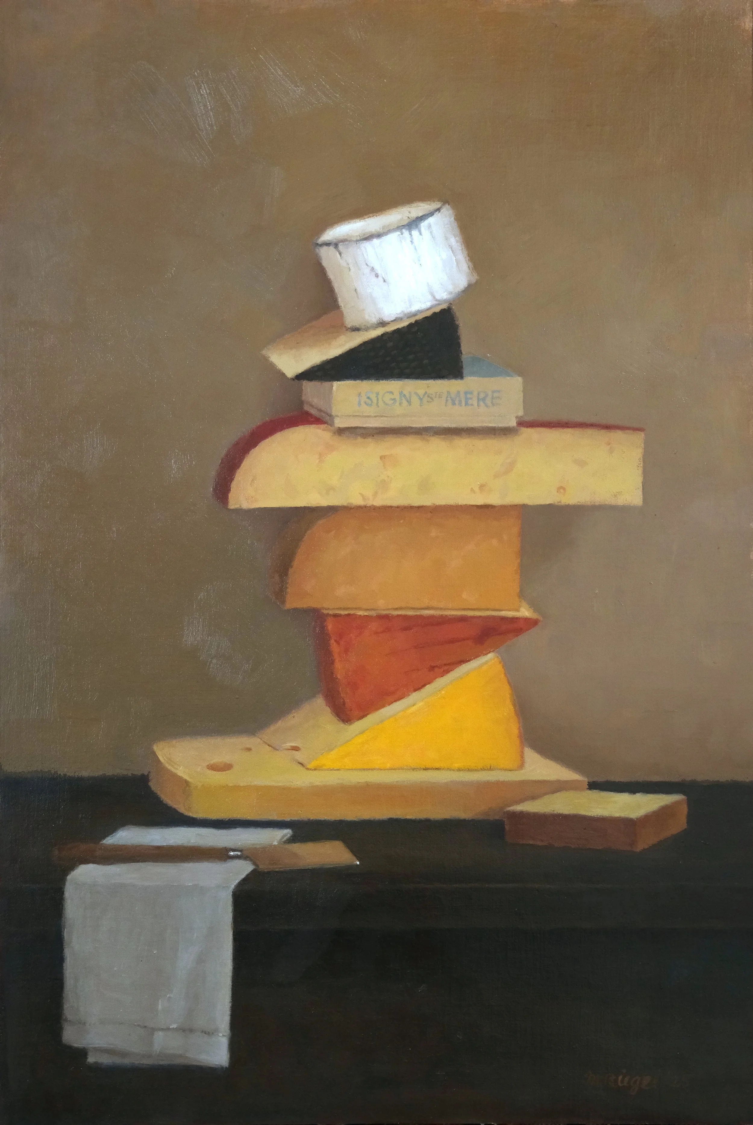 Stacked cheese pieces on a wooden board with a small white towel hanging from the edge, against a neutral background.