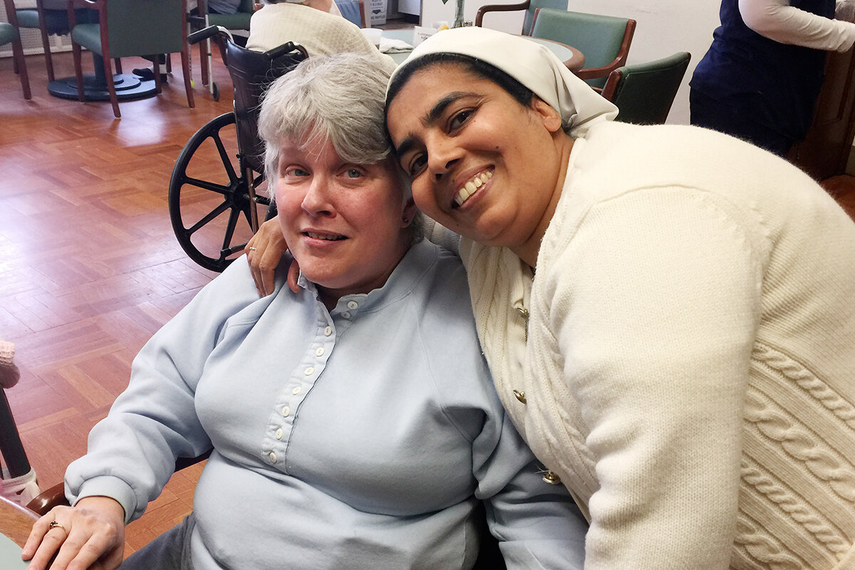  Sister Gracy Kundukulam (right) shares a smile with Dana Funk, a resident of Mt. Assisi Place personal care home in Pittsburgh, Pa. 