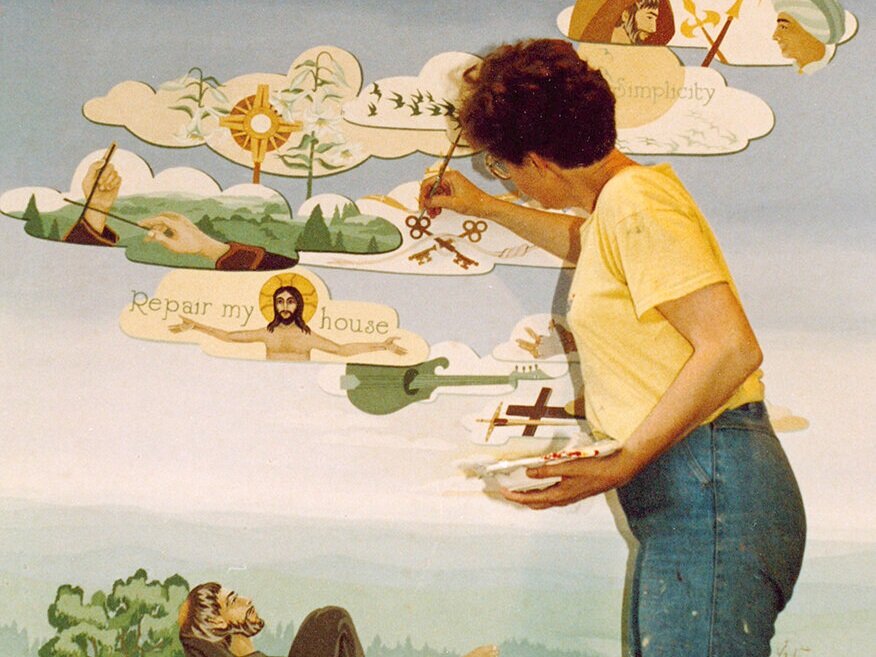  Sister Jo Goolish puts the finishing touches on a Franciscan mural. 