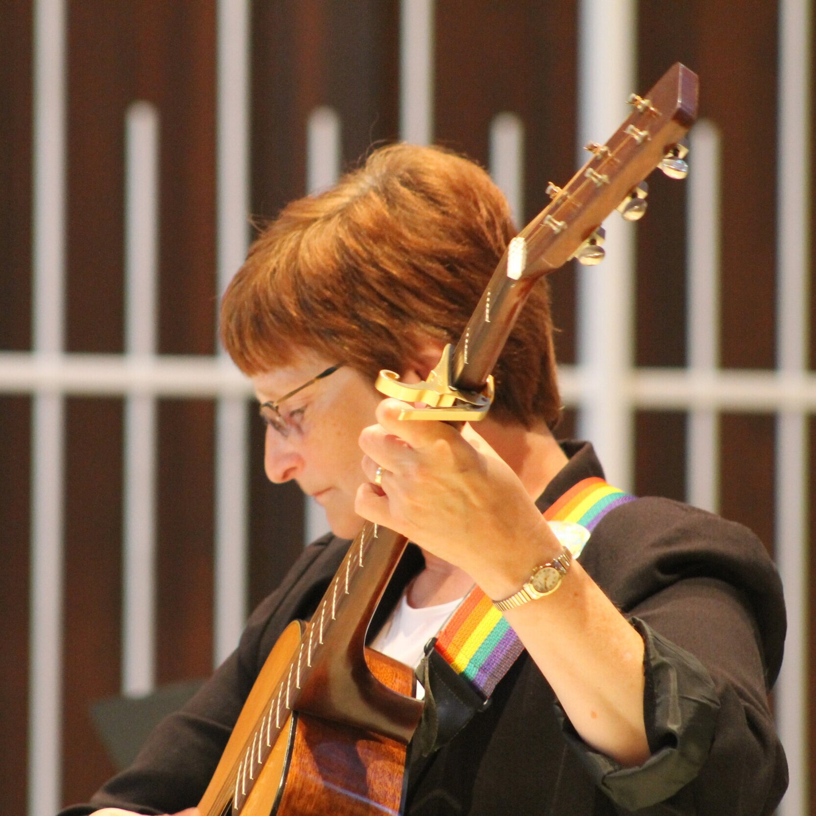 Sister Barbara Brown plays guitar during our Centennial Mass in 2013.