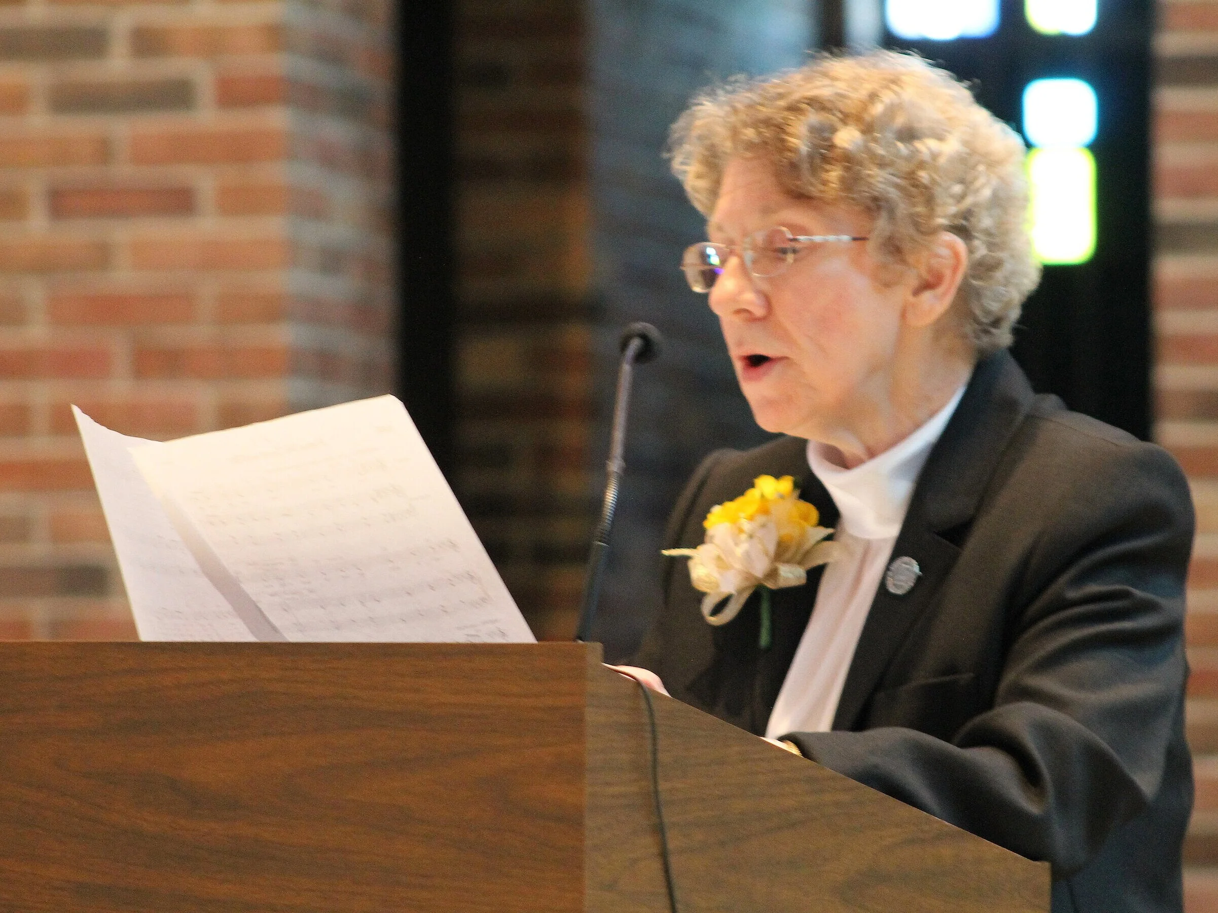 Sister Patricia Ann Mahoney leads those gathered in song during a Jubilee celebration.