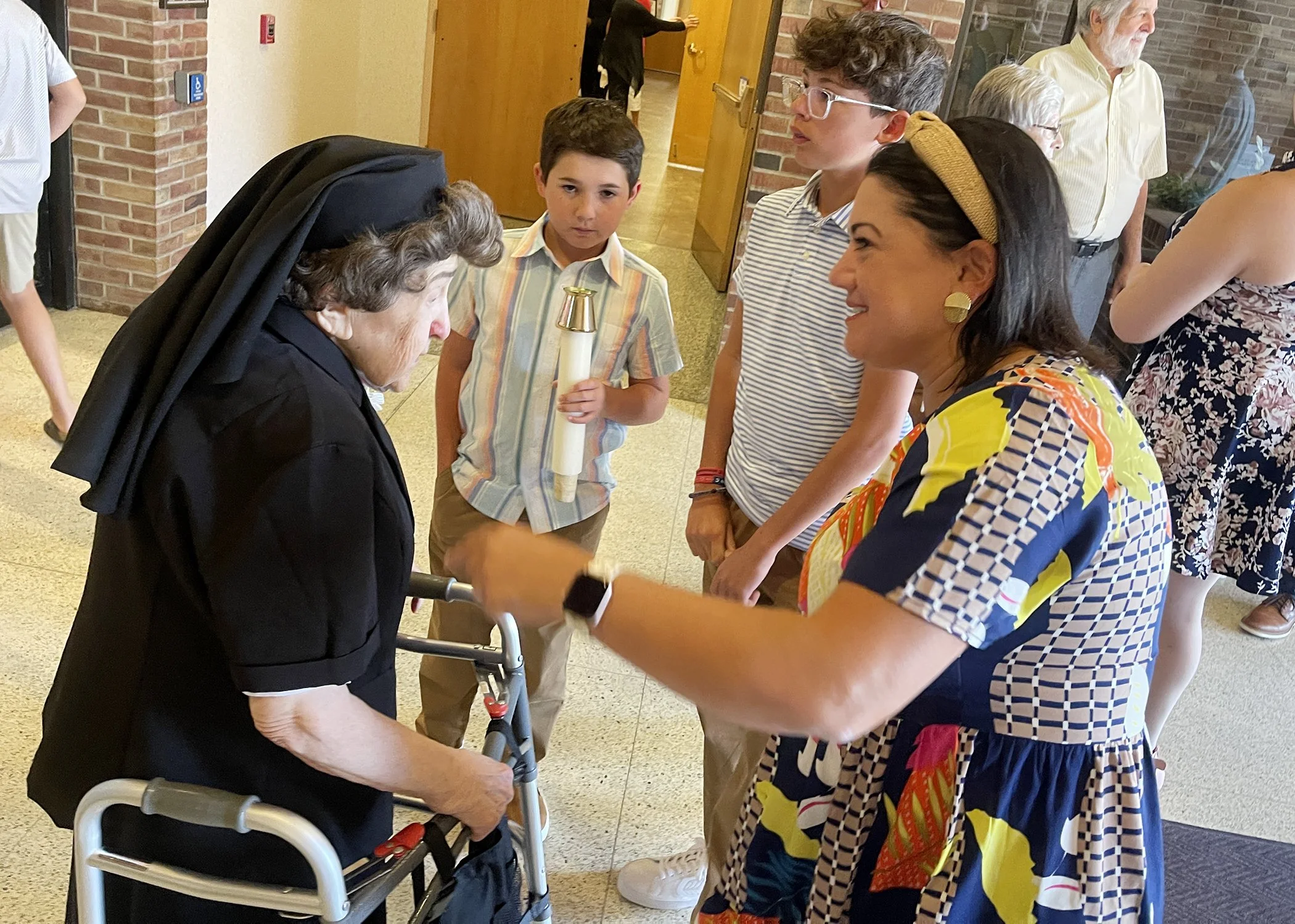  Sister Cecilia Jacko greets family members as they arrive for her 75th Jubilee Mass on July 13, 2024. 