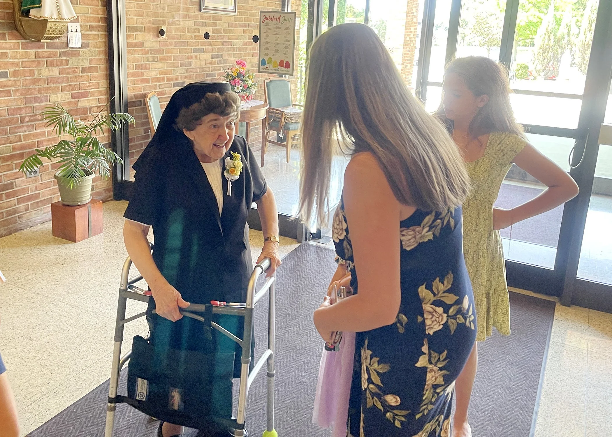  Sister Cecilia Jacko greets family members as they arrive for her 75th Jubilee Mass on July 13, 2024. 