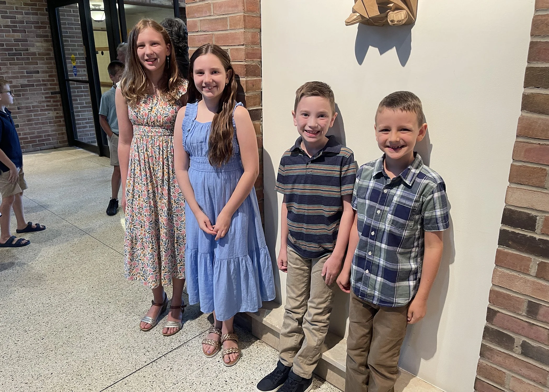  Young members of the Jacko Family await their participation in Sister Cecilia Jacko's 75th Jubilee Mass at Mt. Assisi Place on July 13, 2024. 