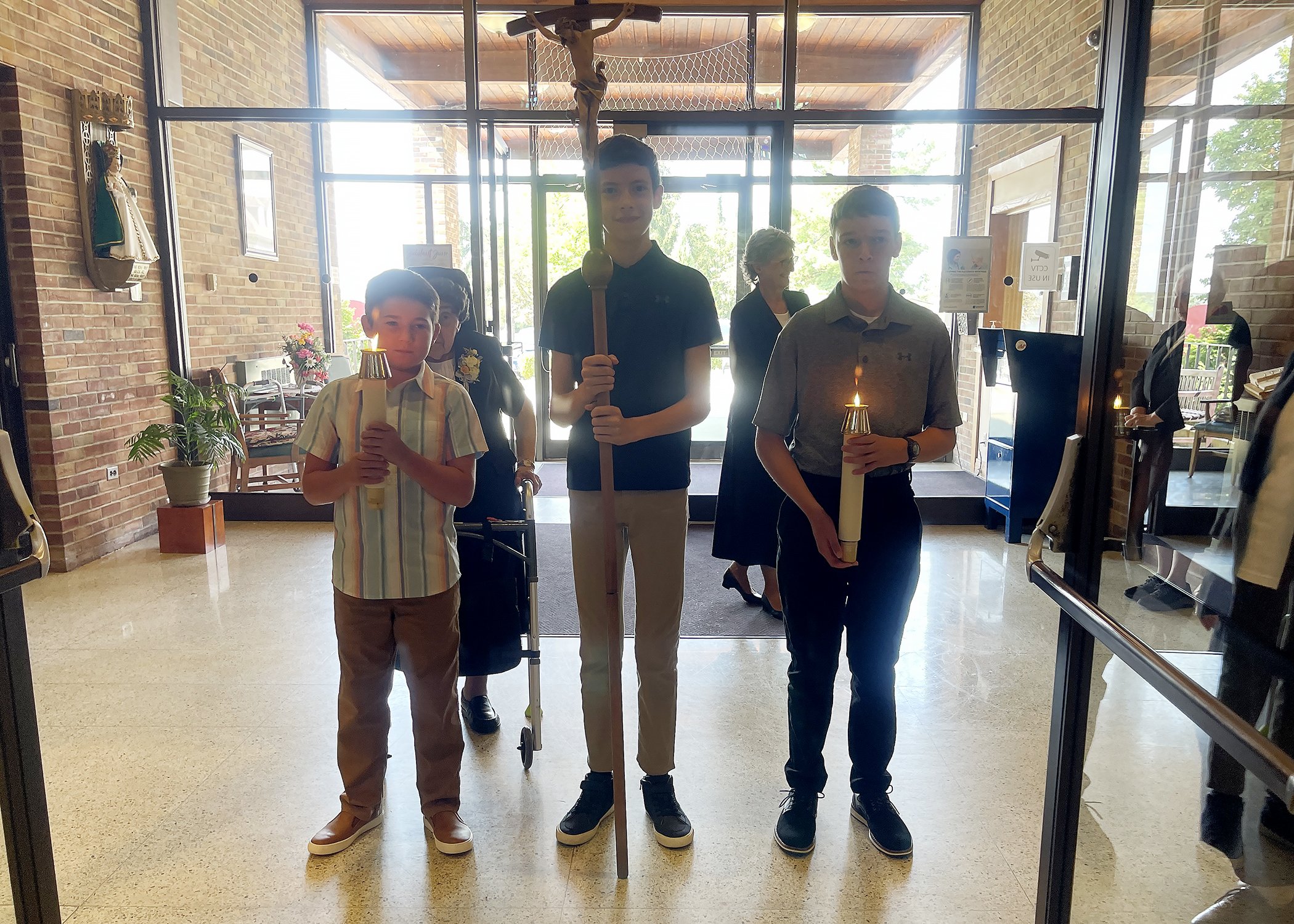  Young members of the Jacko Family lead the entrance procession for Sister Cecilia Jacko's 75th Jubilee Mass on July 13, 2024. 