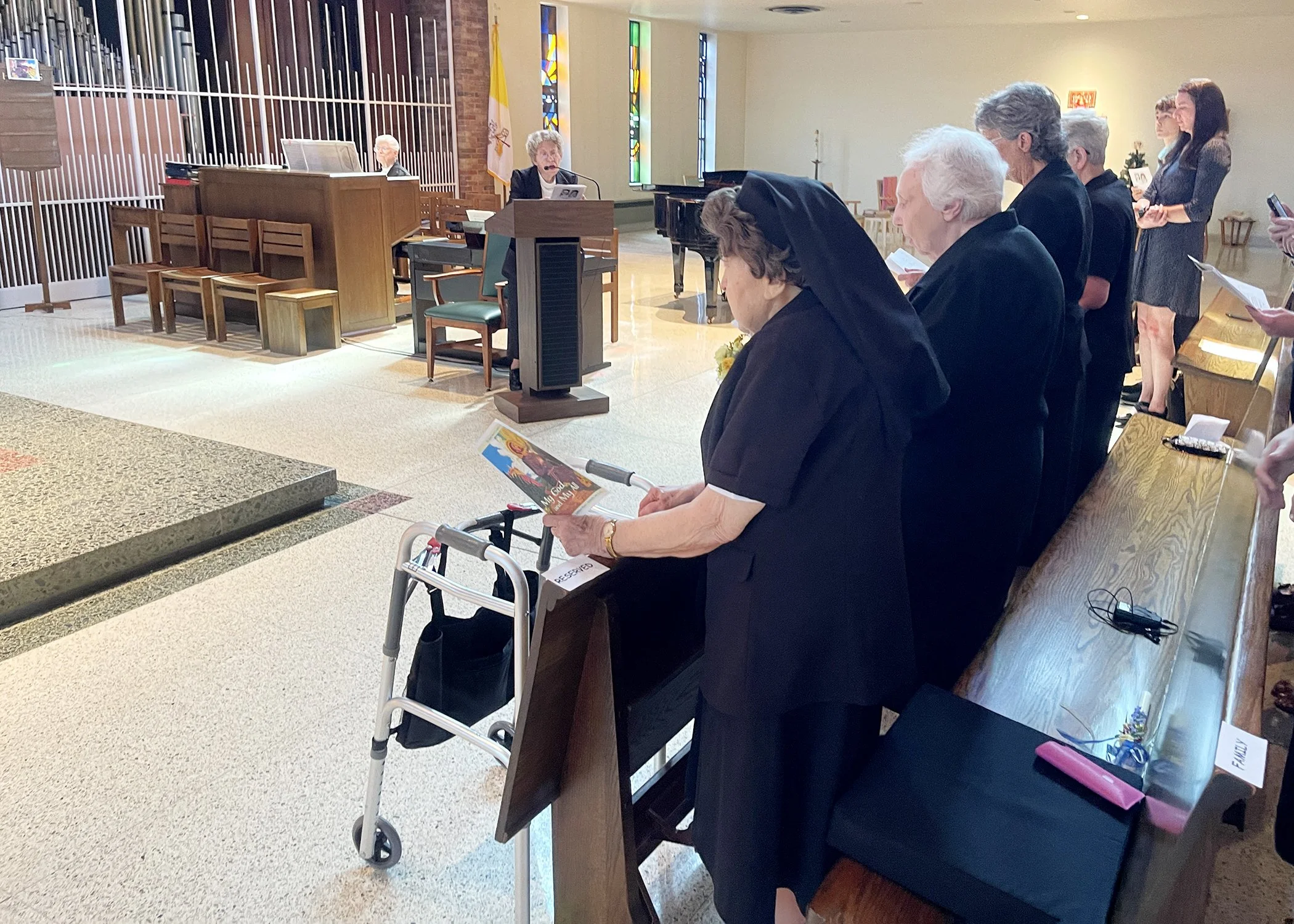  Sister Cecilia Jacko listens as Father Richard Zelik speaks during her 75th Jubilee Mass on July 13, 2024. 