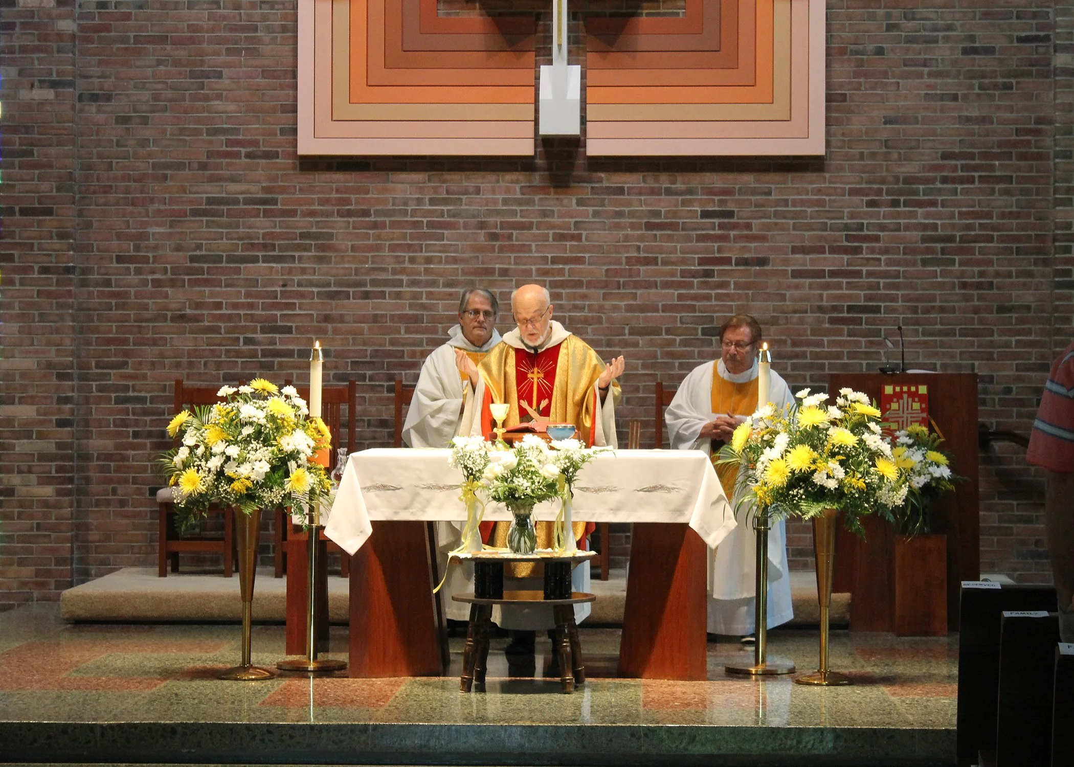 Fathers Richard Zelik (center), John Bachkay (left) and Donald Buchleitner (right) concelebrate Sister Cecilia Jacko's 75 Jubilee Mass on July 13, 2024. 