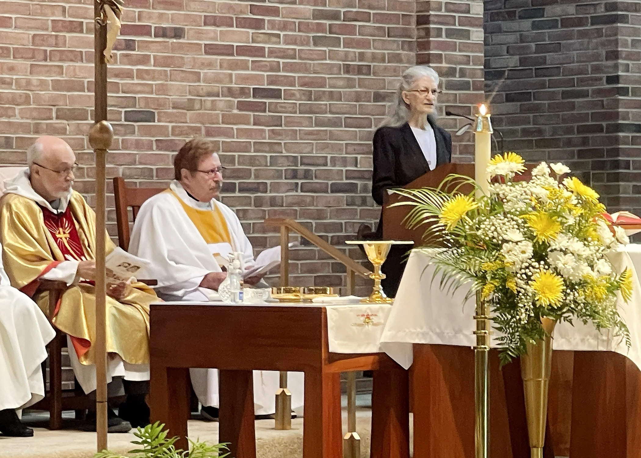  Sister Frances Marie Duncan, general minister of the School Sisters of St. Francis, reads during the 75th Jubilee Mass for Sister Cecilia Jacko on July 13, 2024. 