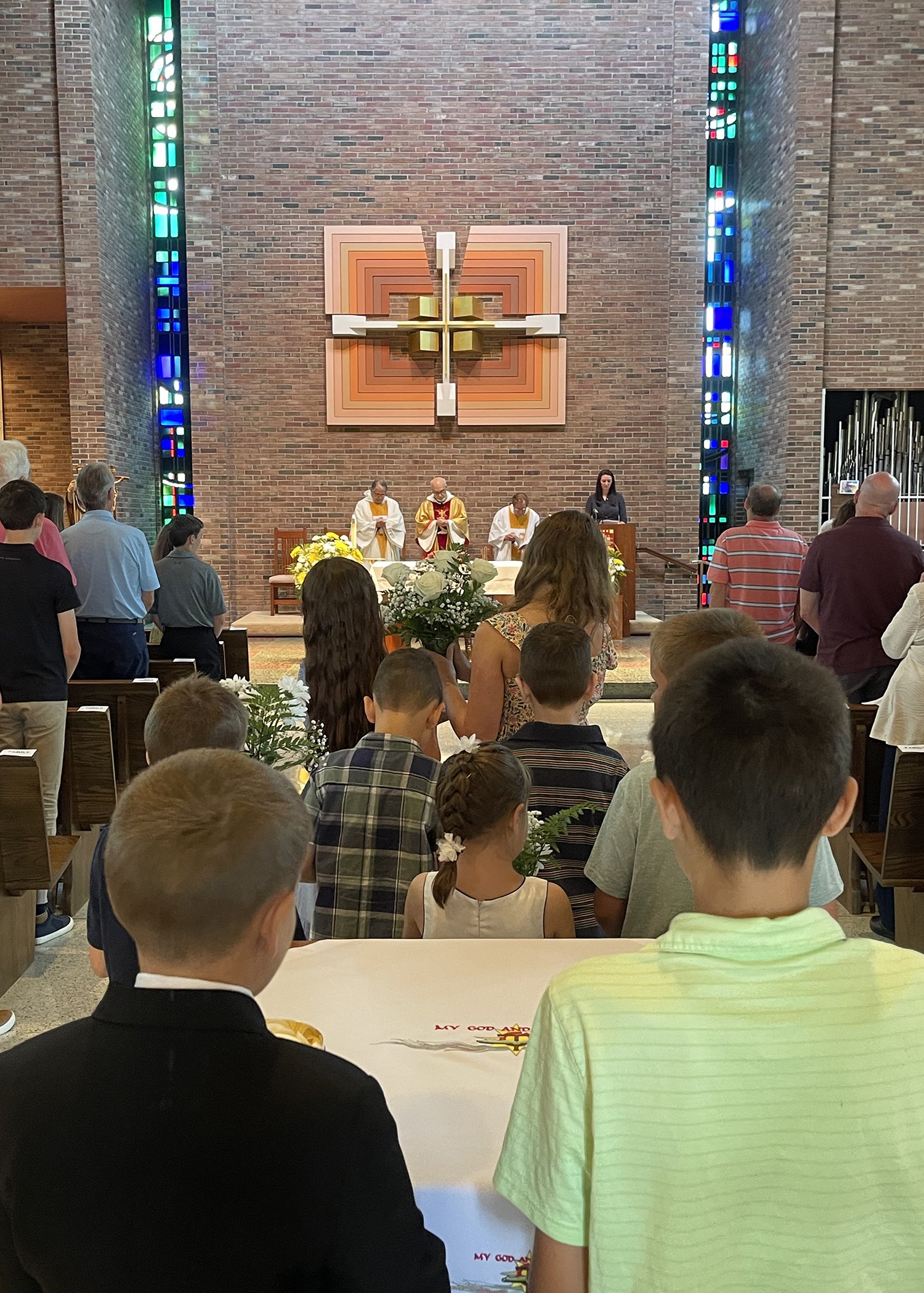  Young members of the Jacko Family form the offertory procession during Sister Cecilia Jacko's 75th Jubilee Mass on July 13, 2024. 