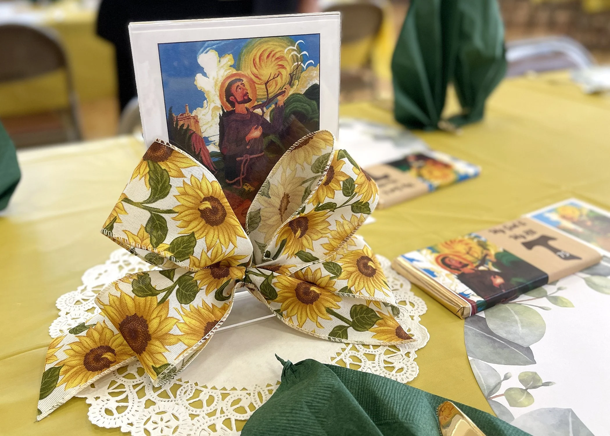  A depiction of St. Francis as the  Passionate Troubador  sets the scene for Sister Cecilia Jacko's 75th Jubilee Celebration on July 13, 2024. 