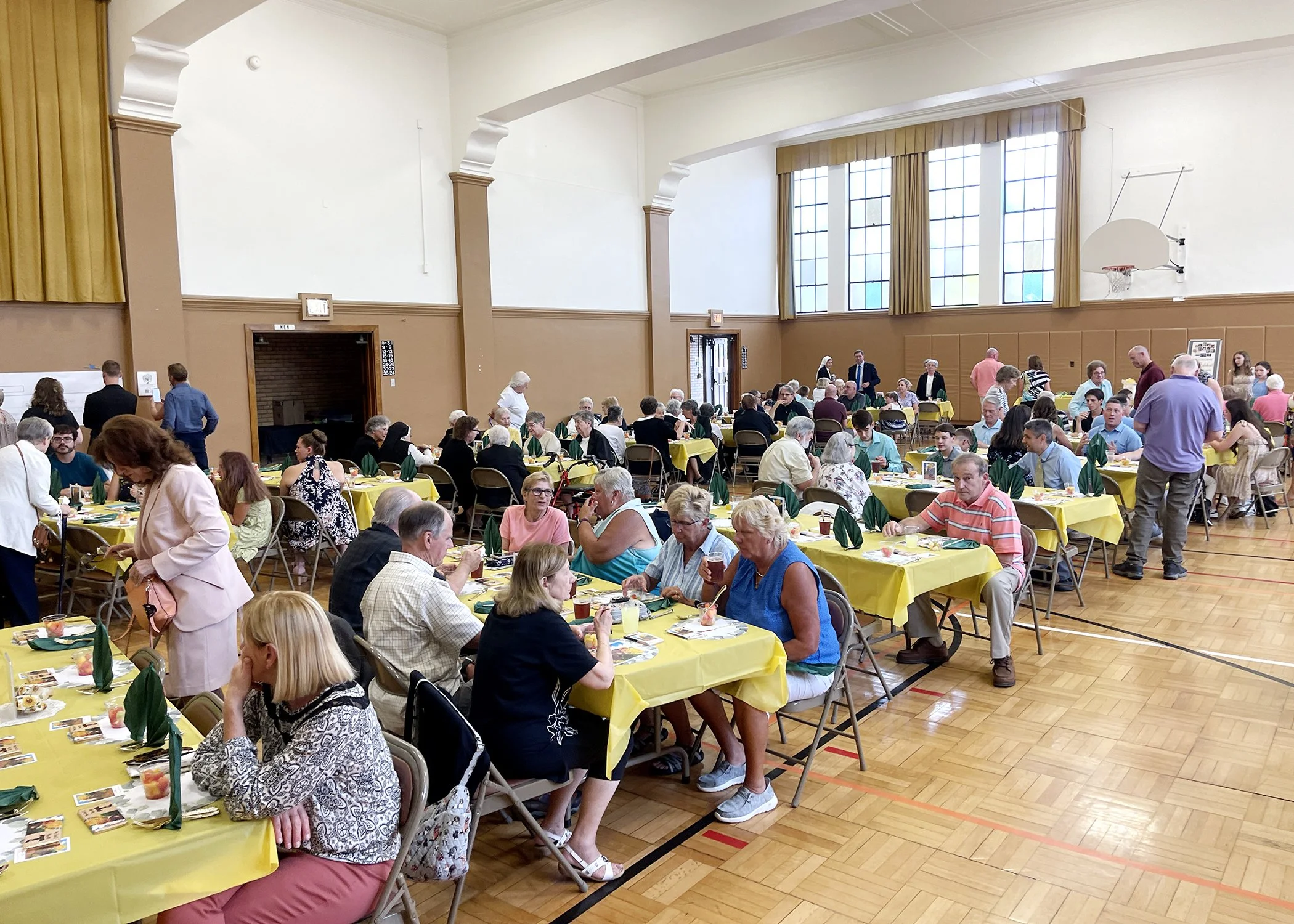  Friends and family fill the gymnasium at Mt. Assisi Place to celebrate Sister Cecilia Jacko's 75th Jubilee on July 13, 2024. 