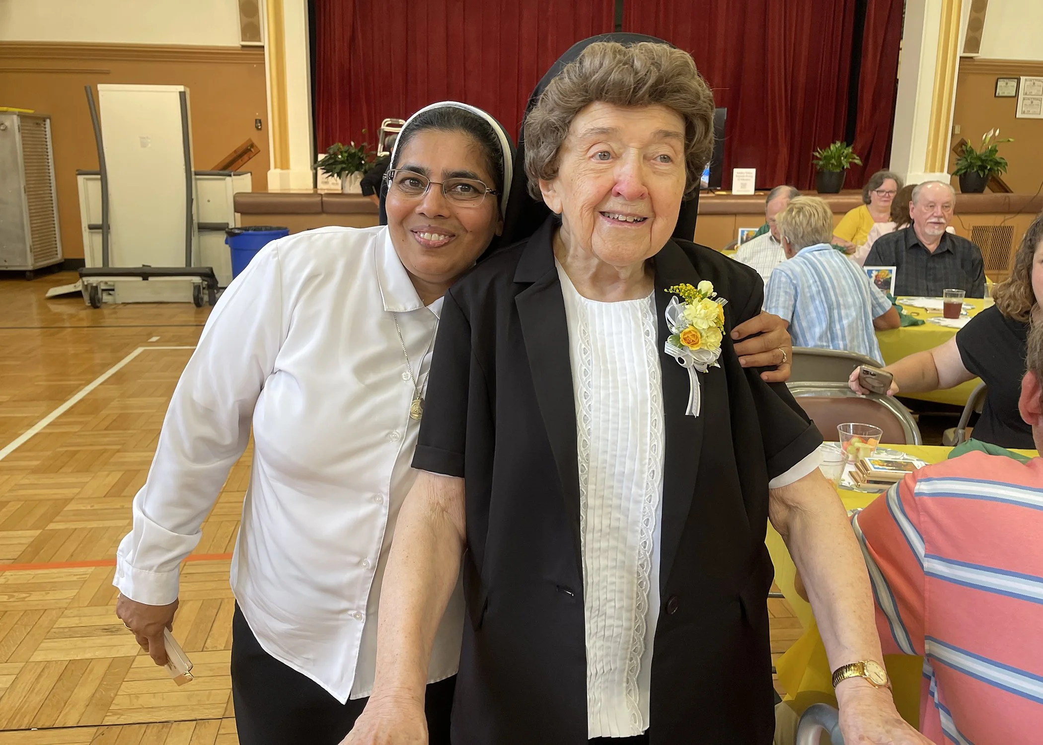  Sister Cecilia Jacko gets a little love from Sister Gracy Kundukulam during her 75th Jubilee celebration on July 13, 2024. 