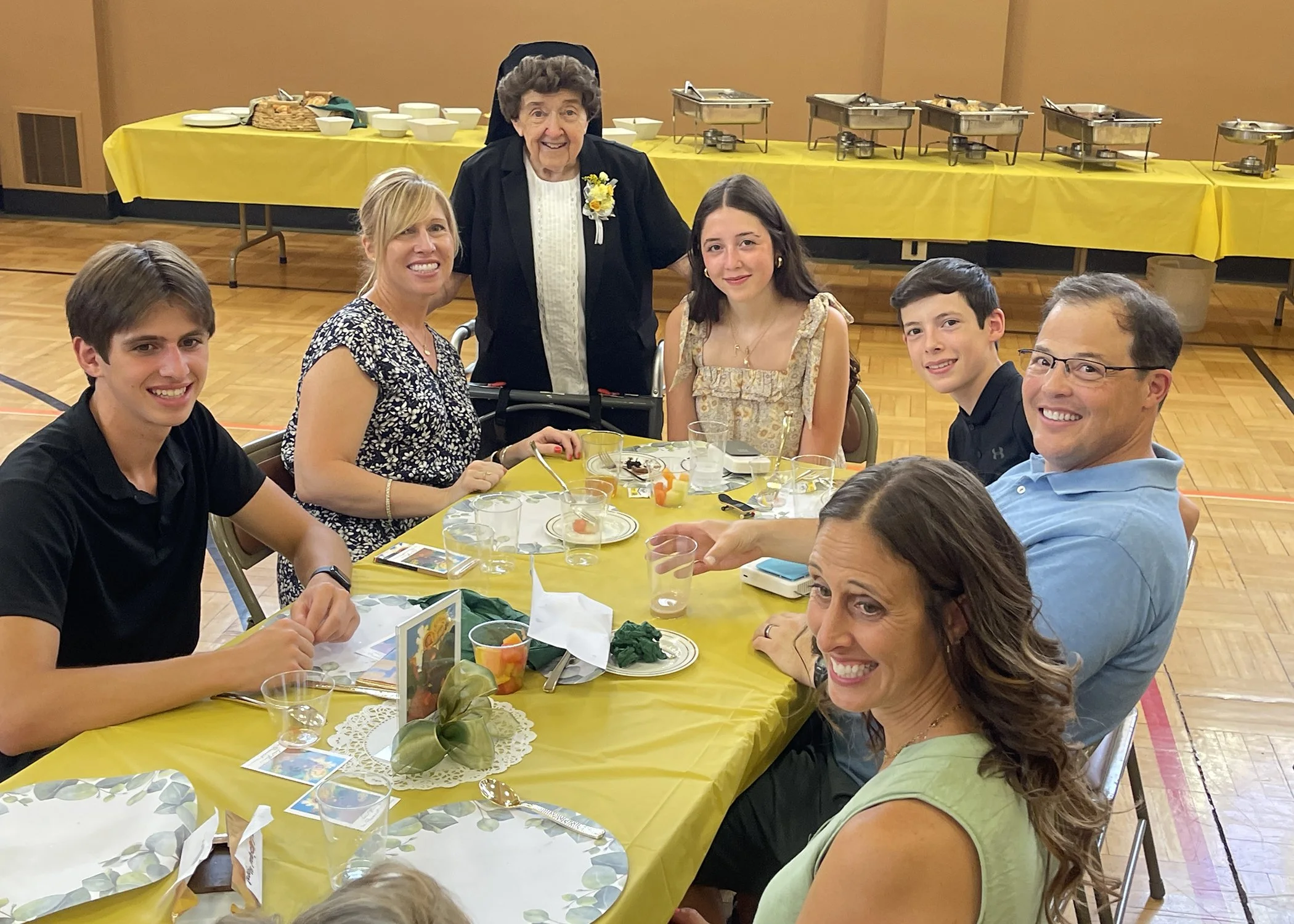  Sister Cecilia Jacko visits with family members during her 75th Jubilee celebration on July 13, 2024. 