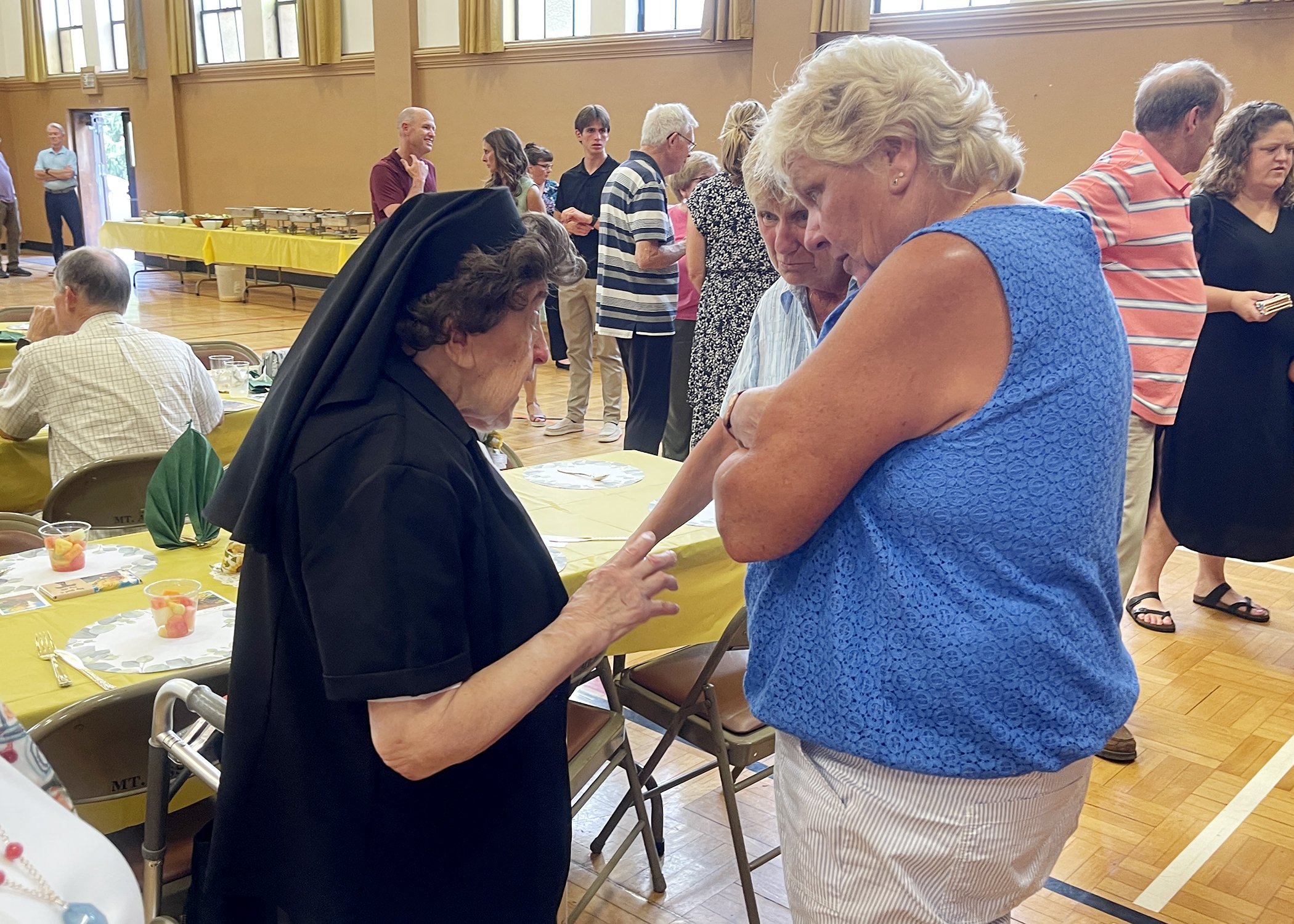  Sister Cecilia Jacko visits with family members during her 75th Jubilee celebration on July 13, 2024. 