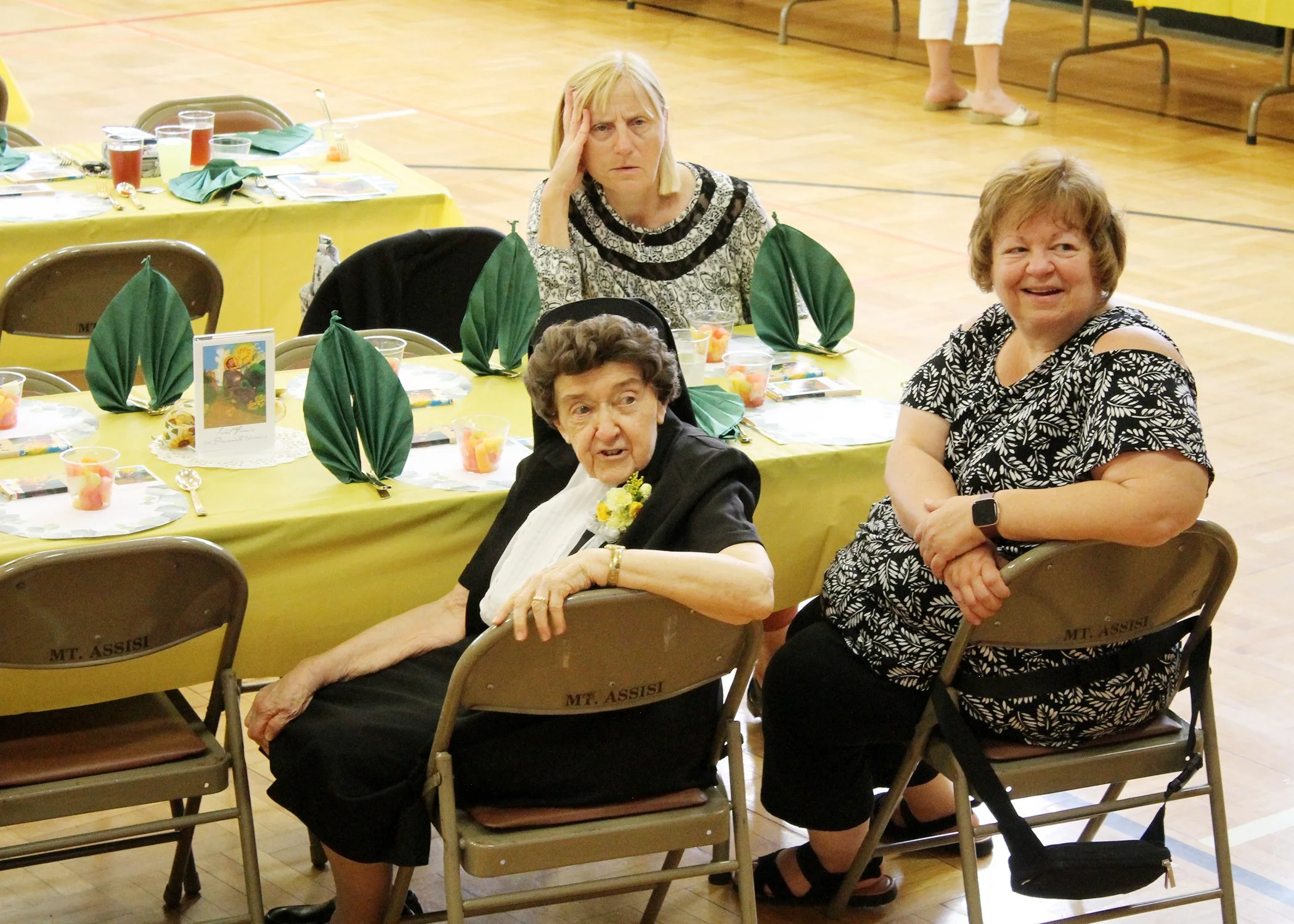  Sister Cecilia enjoys a nostalgic slideshow in her honor during her 75th Jubilee celebration on July 13, 2024. 