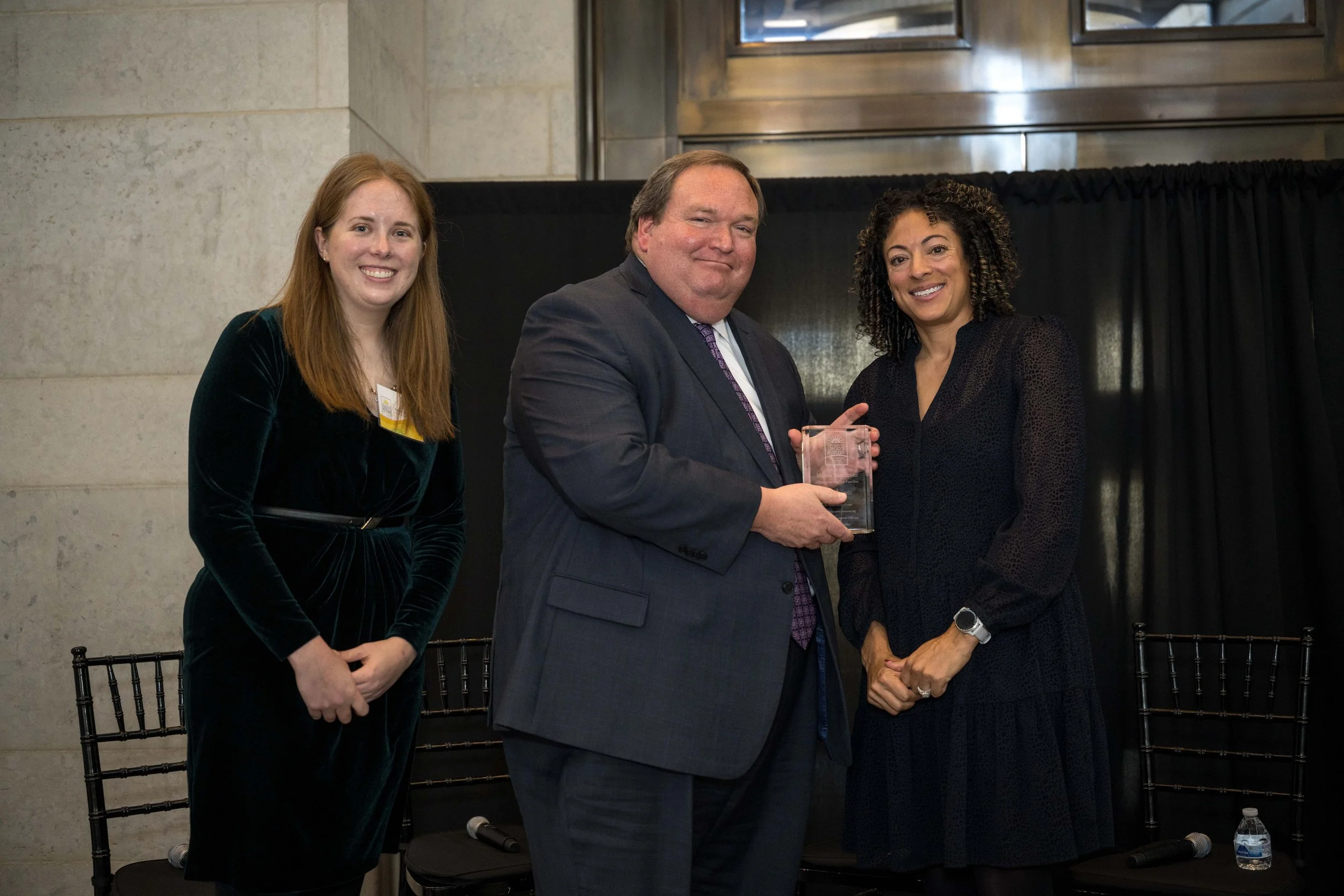  Sarah Hudacek, ODJFS Director Matt Damschroder, and Gina Wilt pose with Director Damschroder’s Champion for Ohio Families Award. 