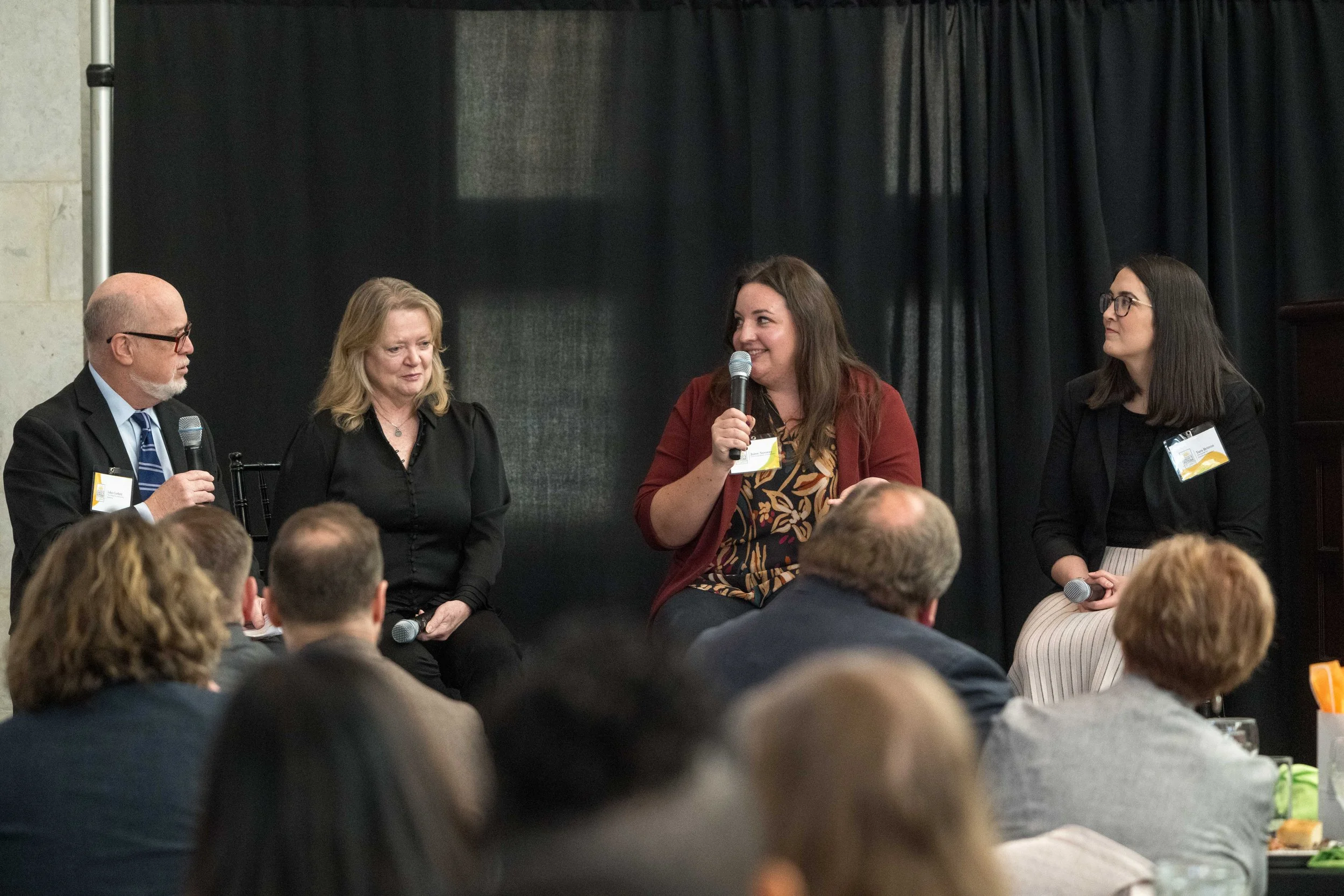  John Corlett, Marcia Egbert, Joree Novotny, and Tara Britton in a fireside chat on stage about coalition work and HHS advocacy. 