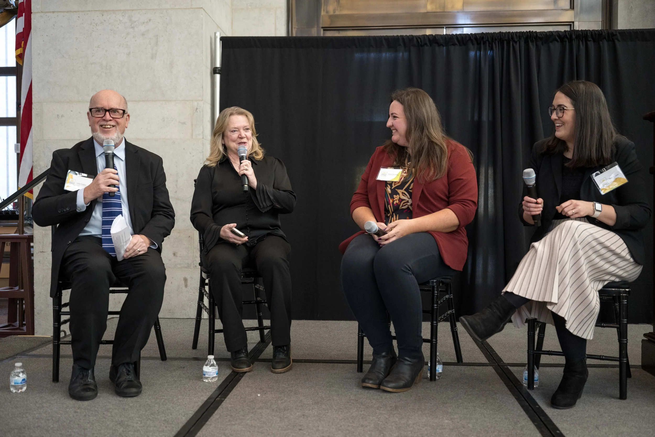  John Corlett, Marcia Egbert, Joree Novotny, and Tara Britton in a fireside chat on stage about coalition work and HHS advocacy. 
