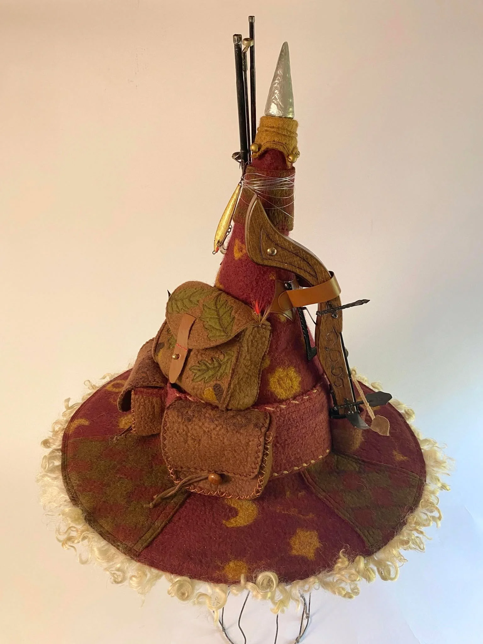 Reveal for Mustrum Ridcully wizard hat.  It came together even better than I had hoped.  I had a lot of fun hunting for all the little detail bits.  I learned some fun new techniques in the process and I'm down half a bottle of silver fingernail poli