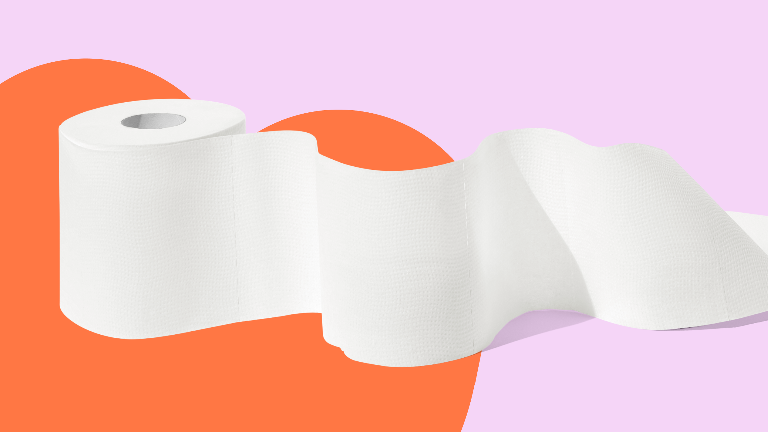 A roll of toilet paper unravelling on a vibrant orange and pink background.