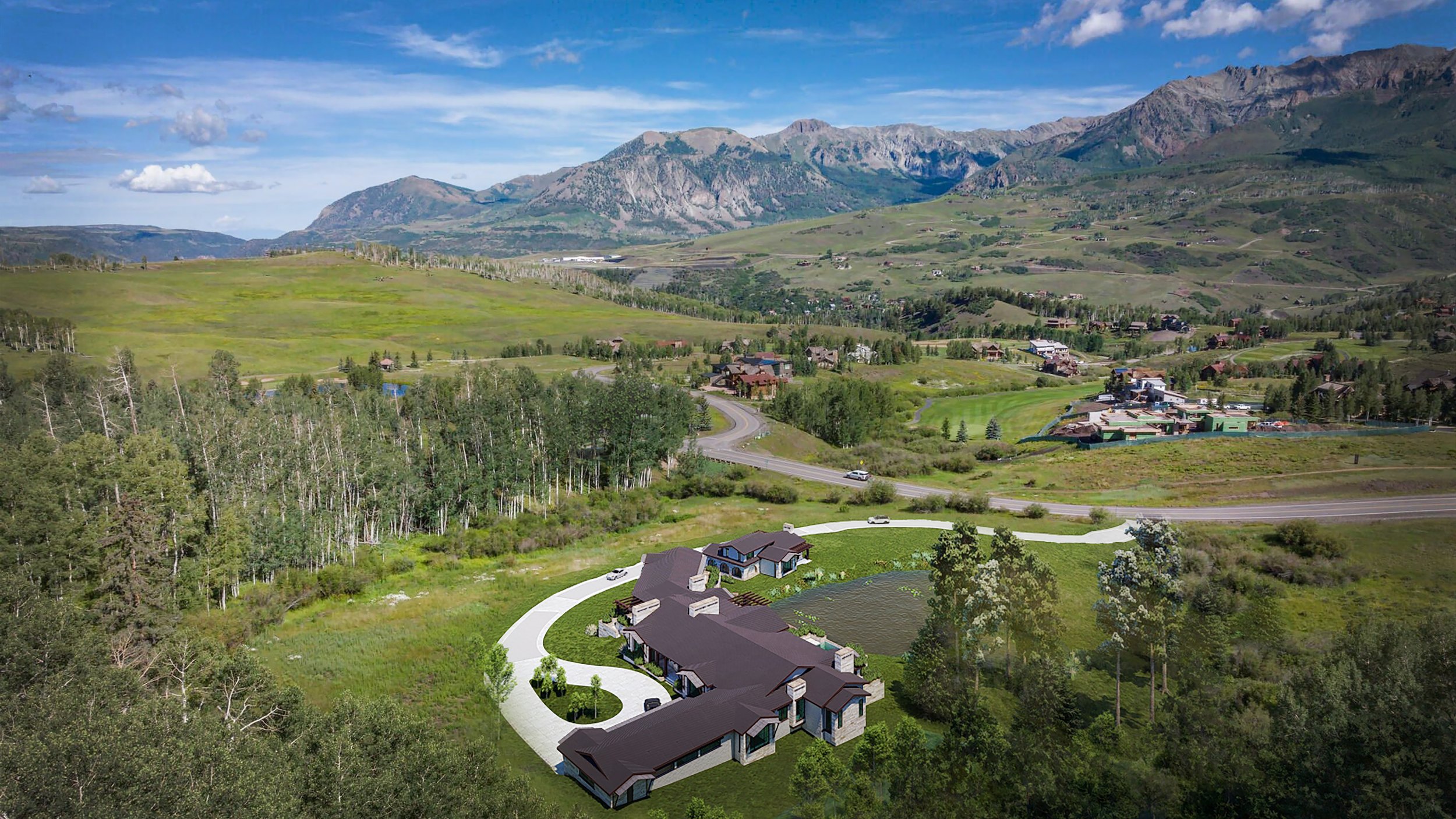 a birds eye view of the sprawling estate at mountain village. the mountains and golf course beyond.