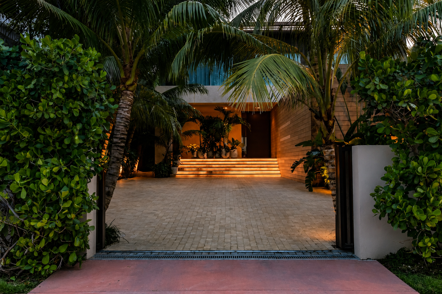 the motor court and glowing underlit front stairs of the bohemian bungalow at rivo alto.