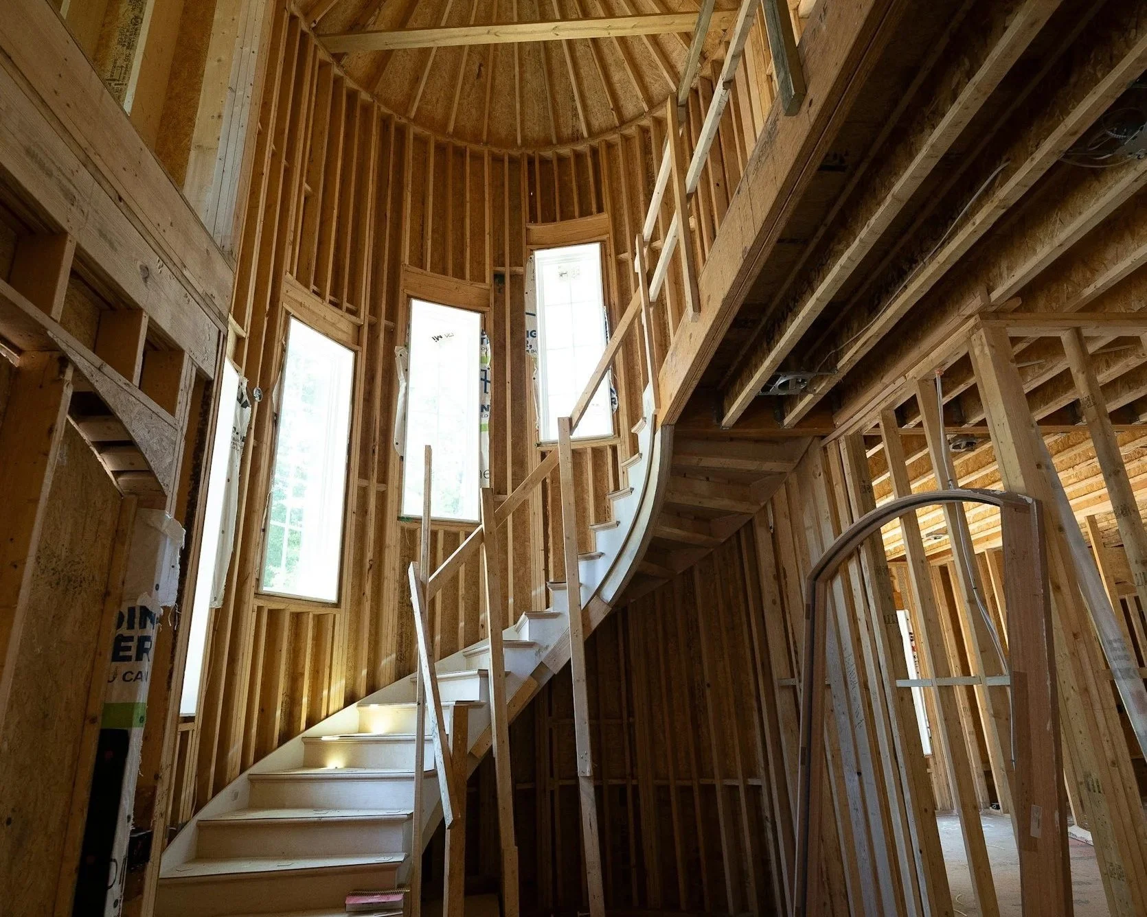 Curved stair and domes ceiling framing for a custom residential project.