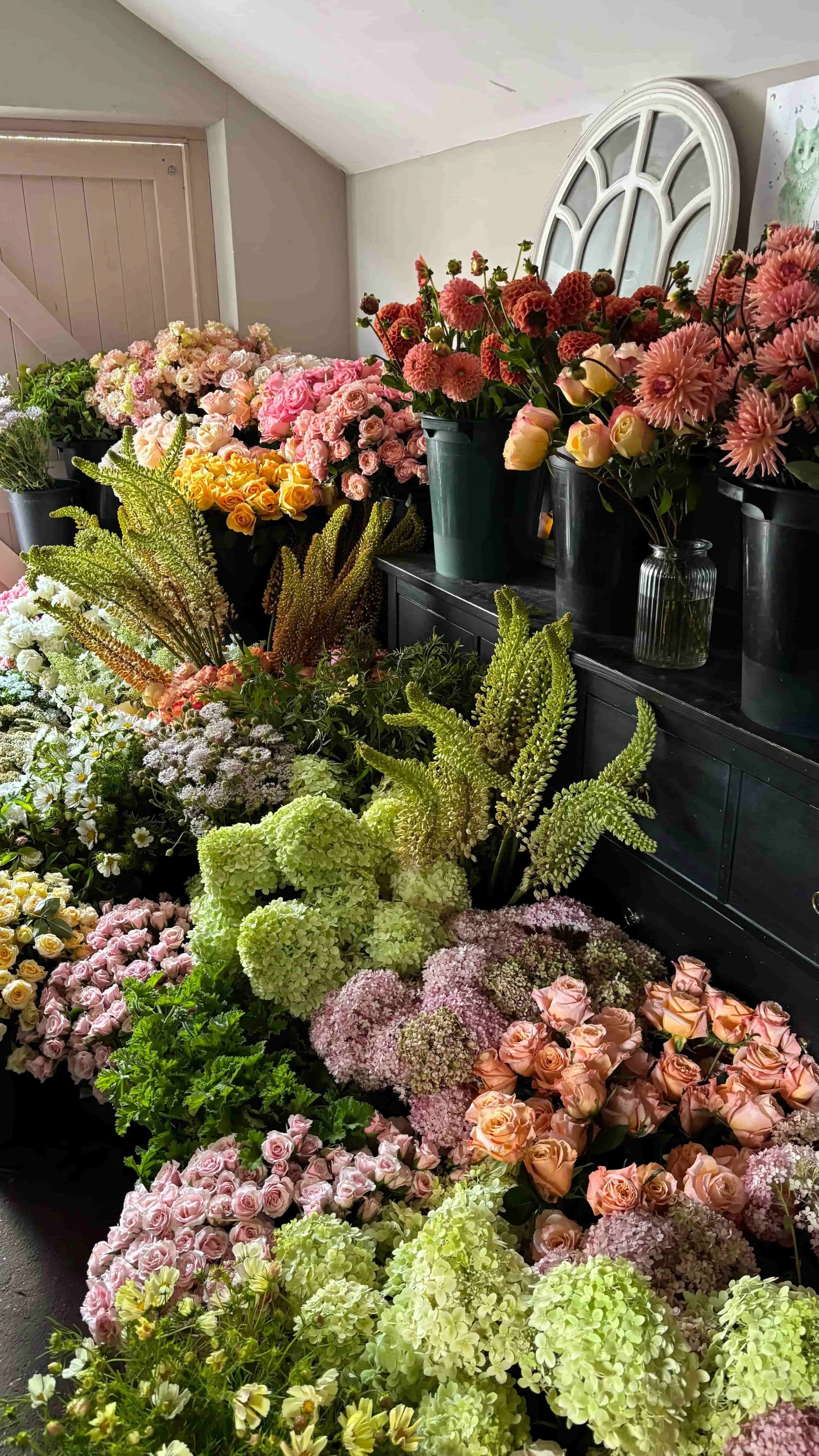 Seasonal roses, hydrangea and summer flowers in pink, peach and apricot tones prepared for a Euridge Manor wedding