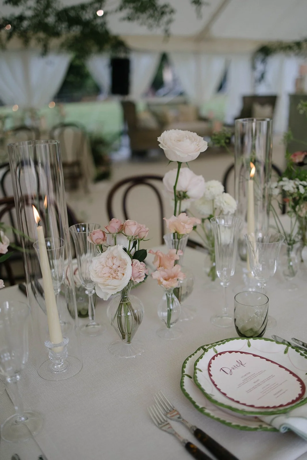 Elegant Cornwell Manor wedding table with blush and white floral centrepieces tall glass candles and menu cards styled by The Botany House wedding florist
