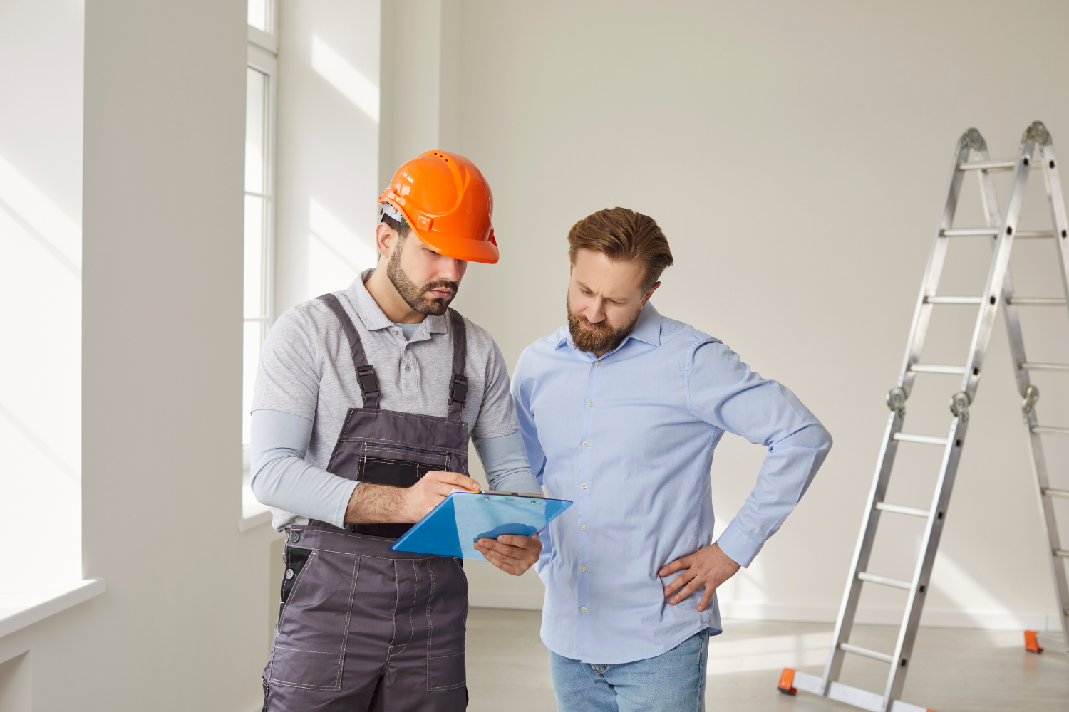 Builder explaining construction plans to a homeowner during a home build consultation in Sydney