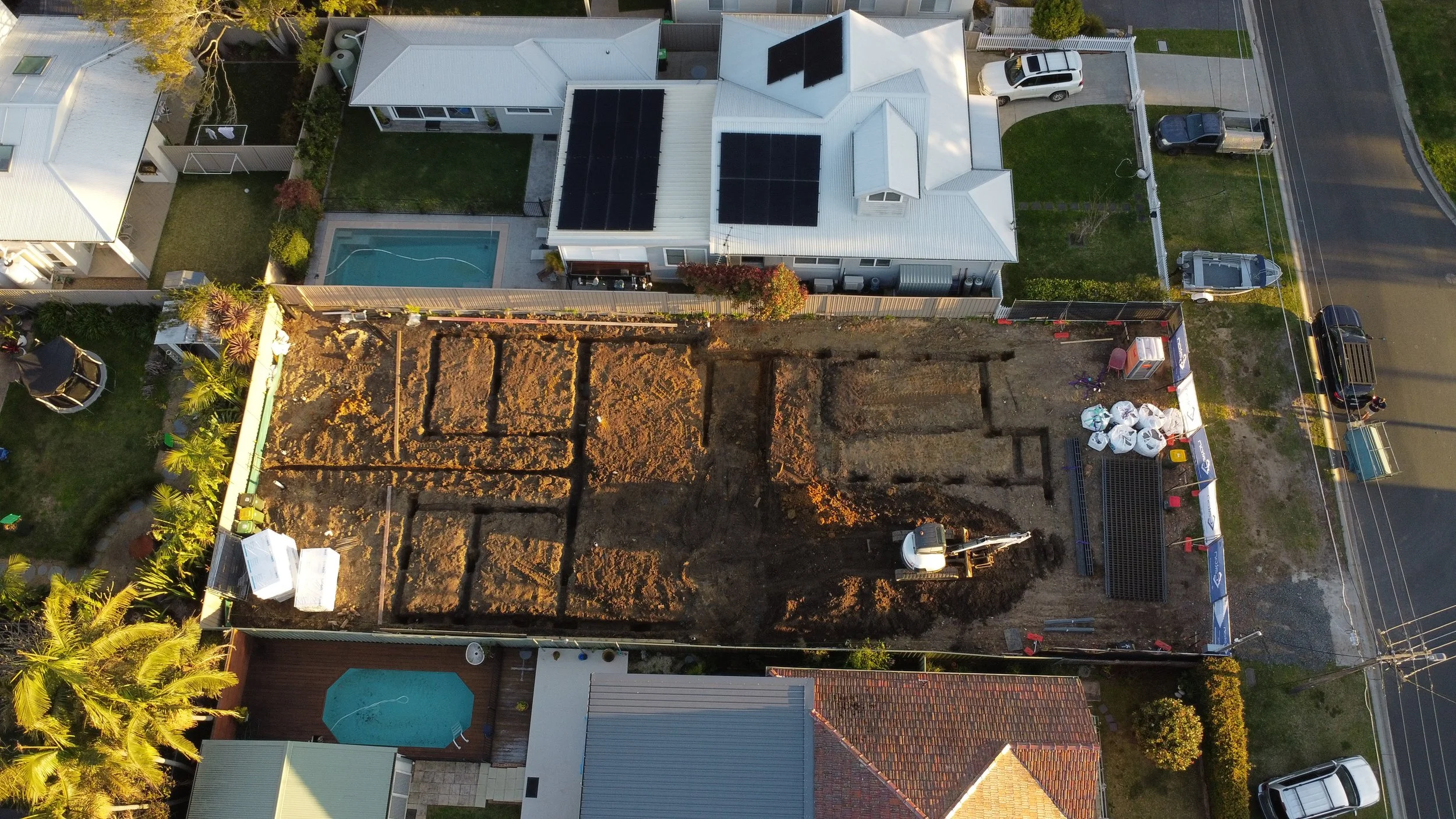 Aerial view of duplex residential site preparation with excavation and early construction works in Kirrawee Sydney