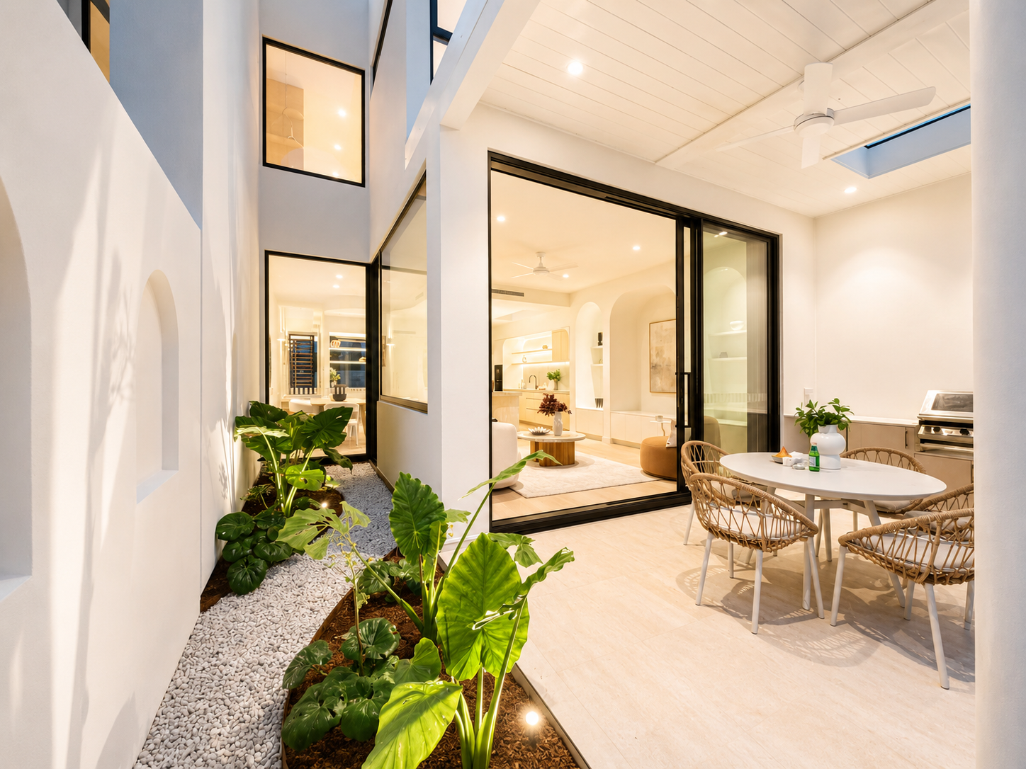 Alfresco entertaining area of the Kirrawee duplex featuring landscaped courtyard gardens, outdoor dining and seamless indoor-outdoor living.