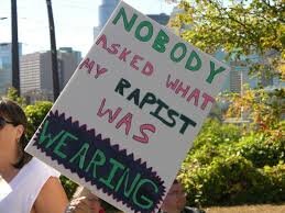  Image description: Picture of a protest sign that says' ‘Nobody asks what my rapist was wearing’ 