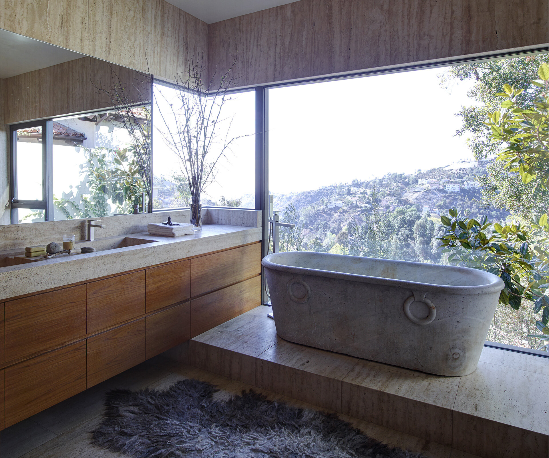  Luxury general contractor award winning architectural modern home for celebrity photographer in the Hollywood Hills neighborhood of Los Angeles featuring glamorous master bathroom suite with Italian bathtub and mountain views.  