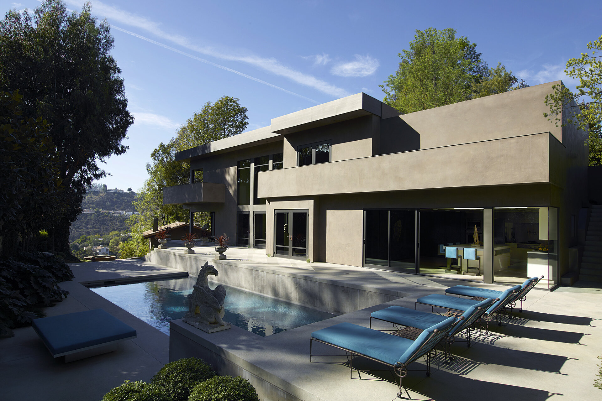  Luxury general contractor award winning architectural modern home for celebrity photographer in the Hollywood Hills neighborhood of Los Angeles featuring award winning architecture by Chu and Gooding with custom pool.  