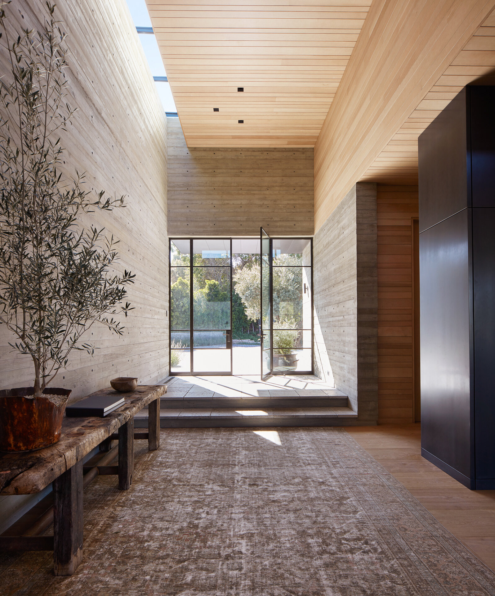  Custom luxury home builder constructed modern private residence in the Pacific Palisades neighborhood of Los Angeles featuring skylights, clerestory windows, wood panel walls.  