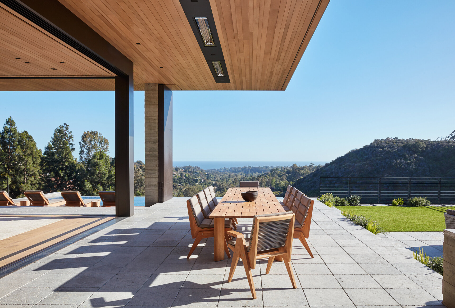  Custom luxury home general contractor built modern private residence in the Pacific Palisades neighborhood of Los Angeles featuring quintessential and iconic views of the ocean with Mid-Century style.  