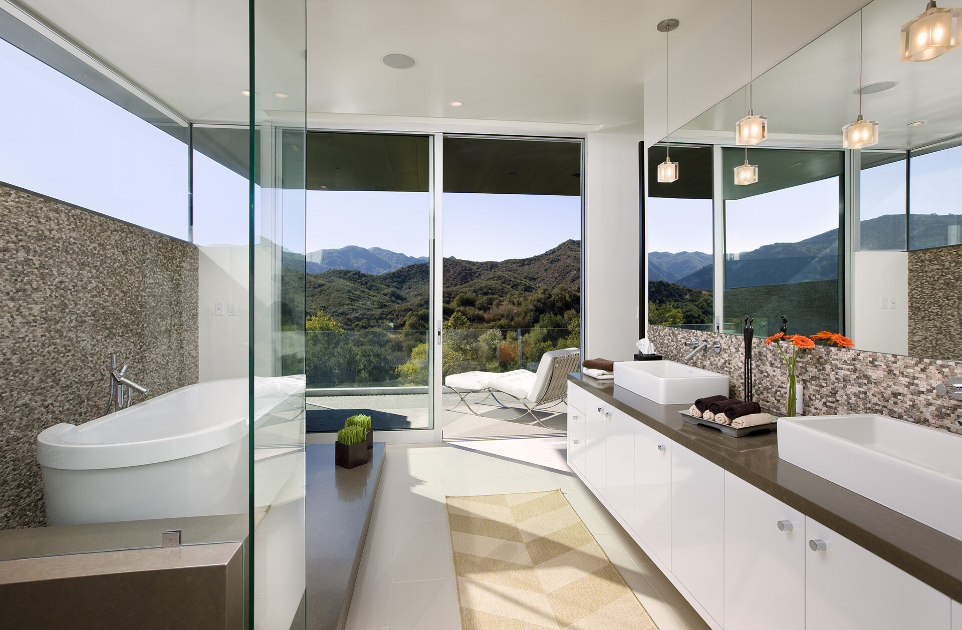  Premium top general contracting services in Calabasas neighborhood of Los Angeles and Southern California custom modern home with gorgeous master suite bathroom featuring freestanding tub in shower and private balcony.  