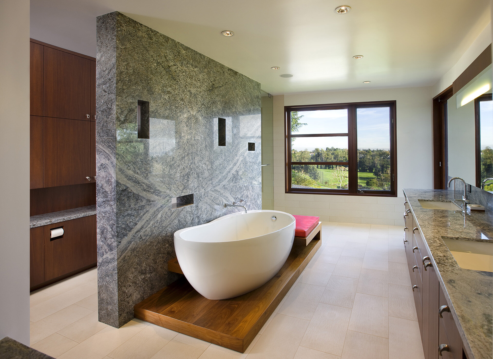  Contemporary general contractor built custom architectural home in the Pacific Palisades neighborhood of Los Angeles featuring master bathroom suite with marble and freestanding bathtub.  