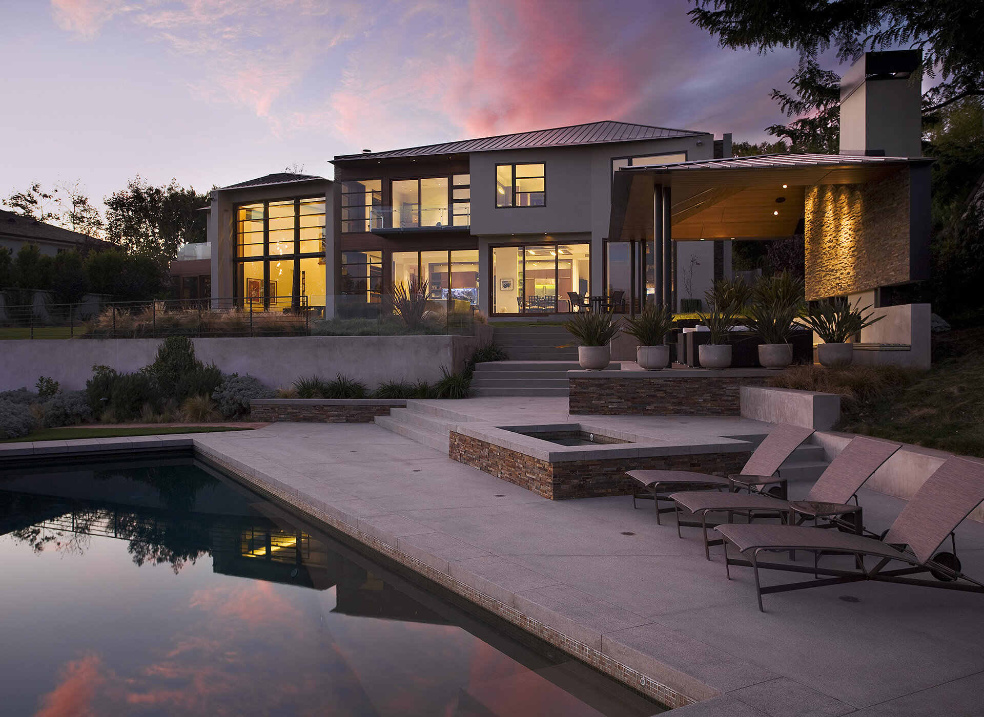  Contemporary general contractor built custom architectural home in the Pacific Palisades neighborhood of Los Angeles with custom window design and installation., outdoor covered living room, and high end zero edge infinity pool.  