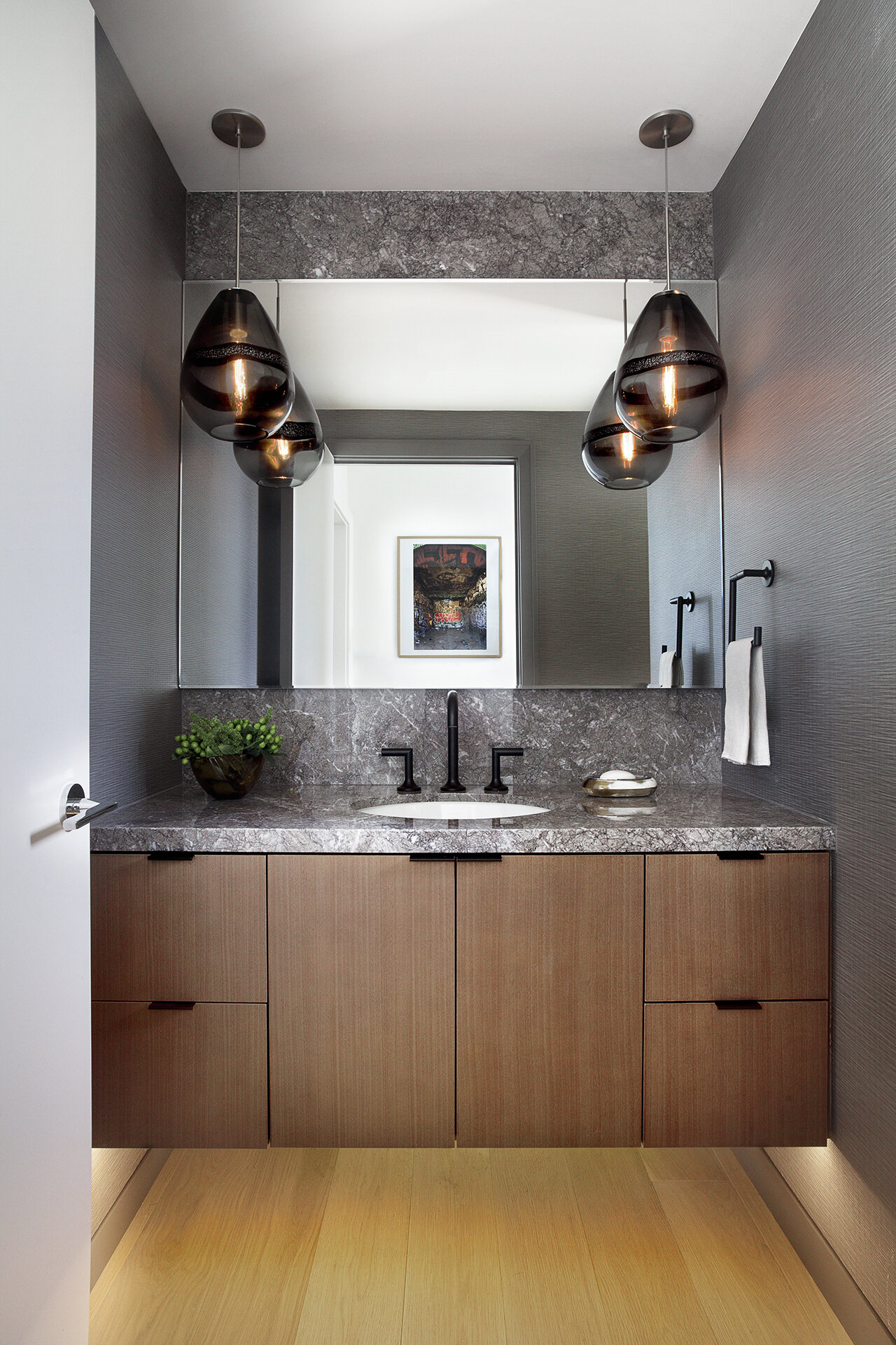  Glamorous and sophisticated bathroom design with Tom Dixon lighting and luxury finishes in Los Angeles. 