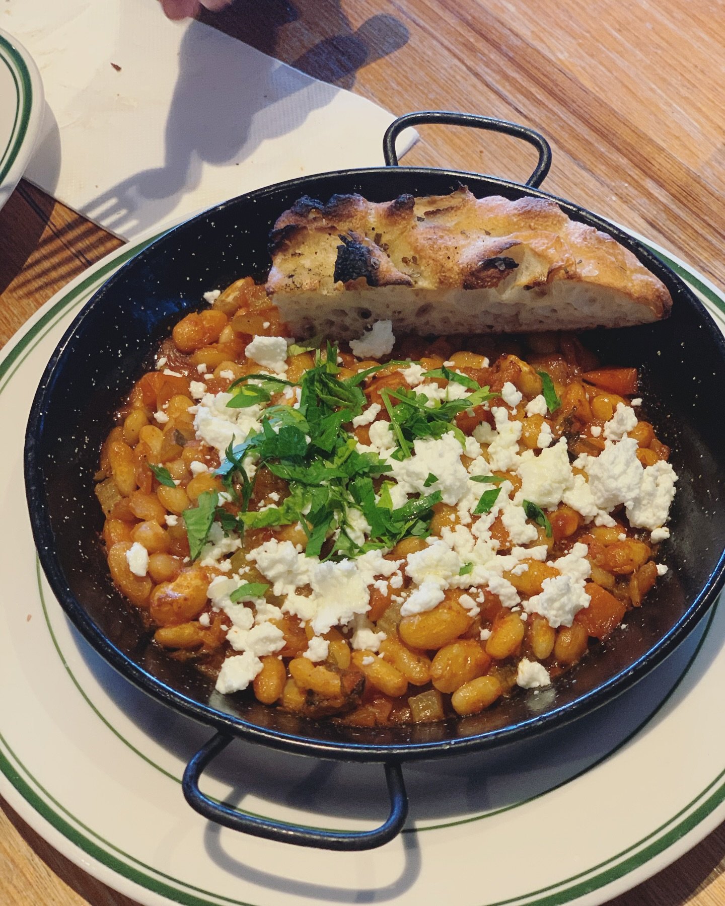Warm winter food.
Greek baked beans, with Meredith goats cheese and house made focaccia.