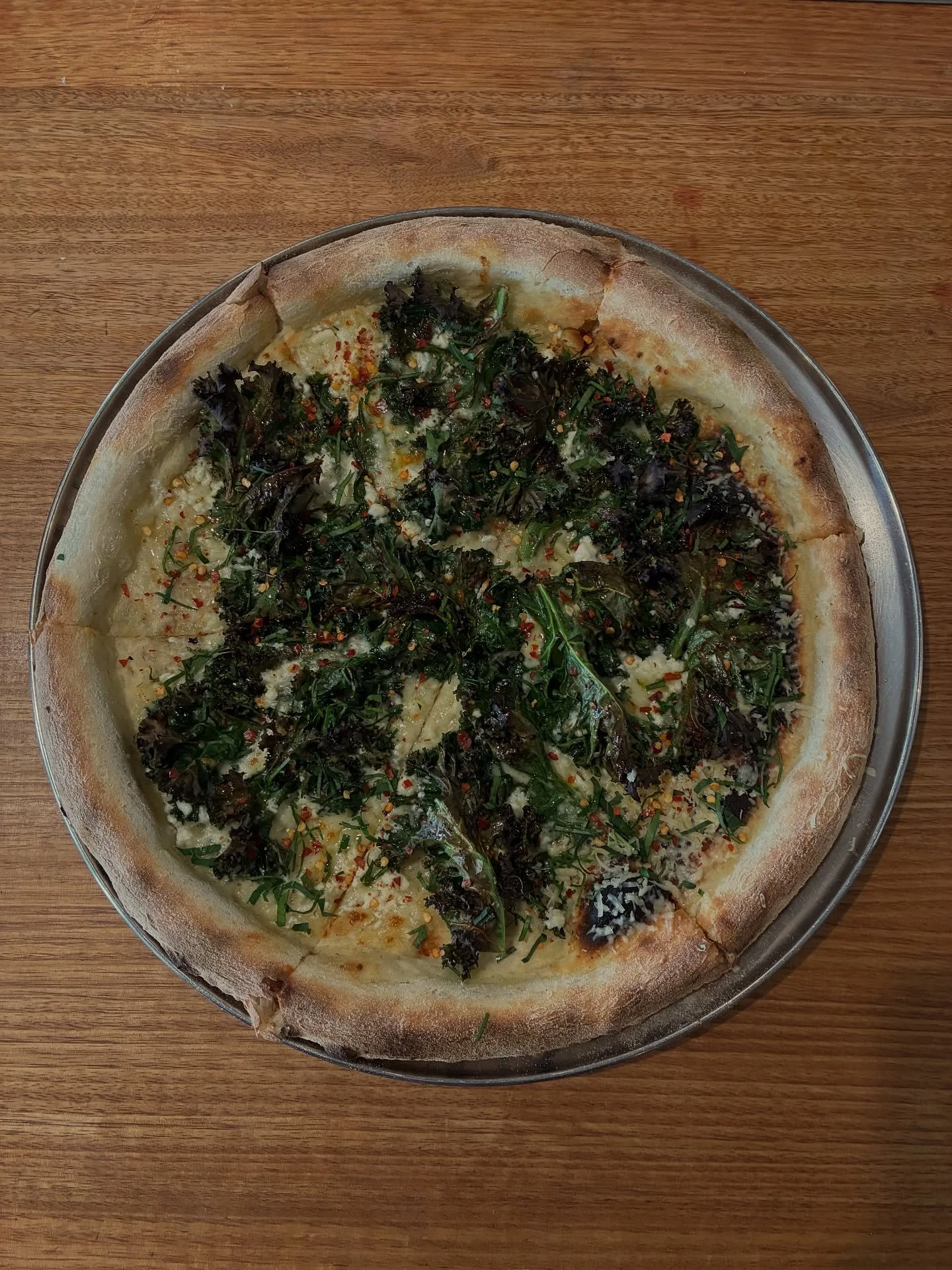 SPANAKOPITA PIZZA- featuring garlic mozzarella base, kale, feta &amp; chilli