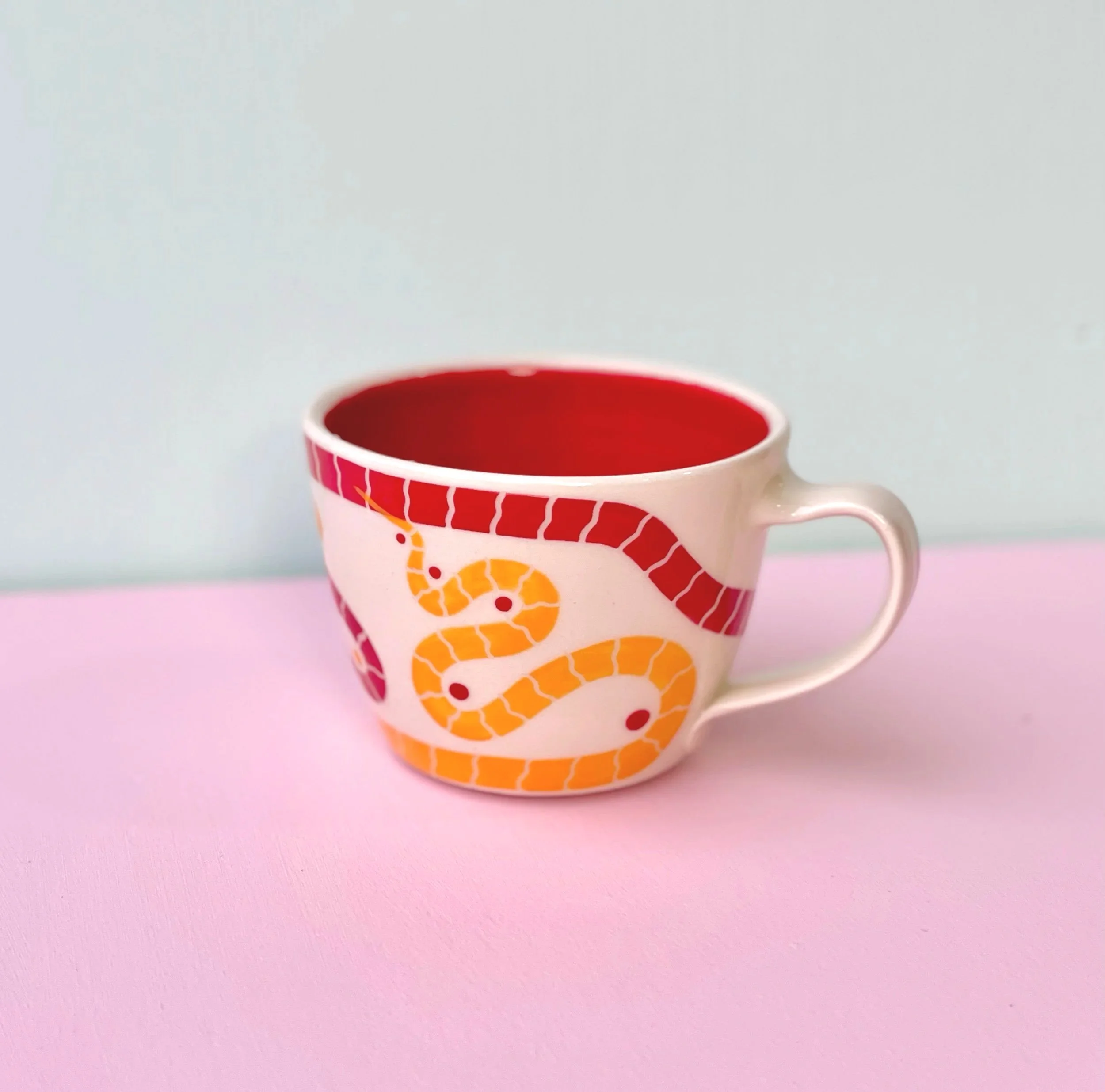 red & yellow snake mug