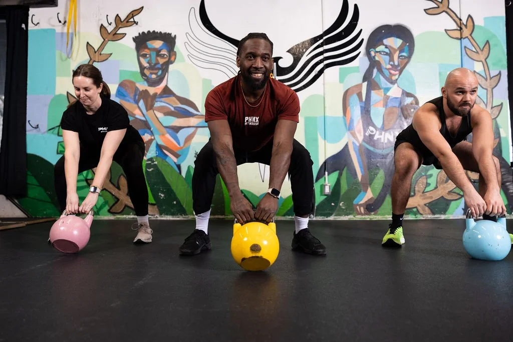 Coach Rolli leading a kettlebell class