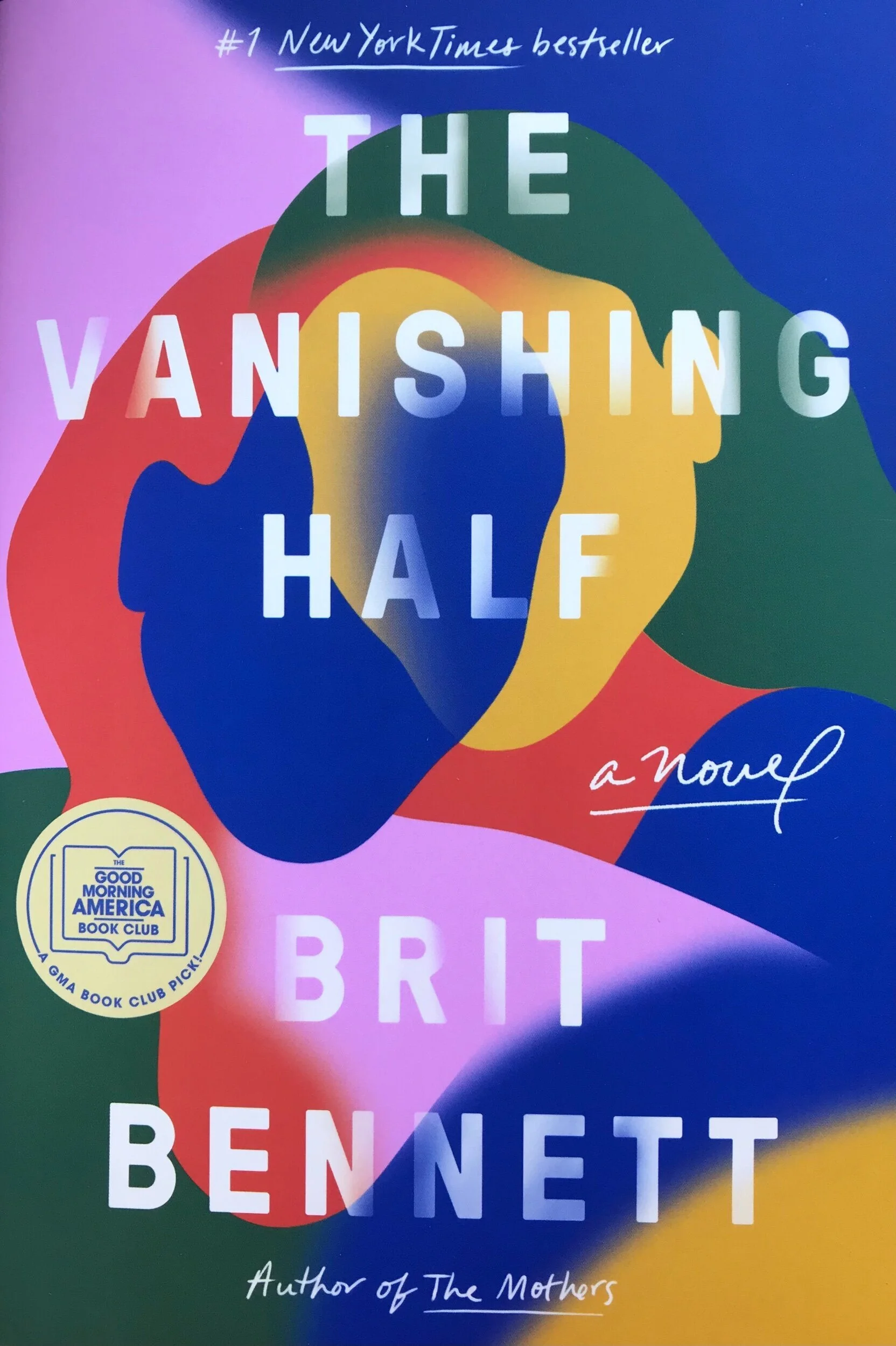 A colourful book cover depicting two shadow faces juxtaposed against each other. The words, "Vanishing Half, a novel Brit Bennett"