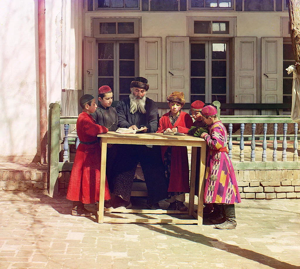 Jewish children with their teacher, Samarkand. Taken between 1905-1915, digitally colored in 2005-2020. Original photo on the right.Source: Prokudin-Gorski photograph collection, Library of Congress. Digital color rendering by Walt Frankhauser