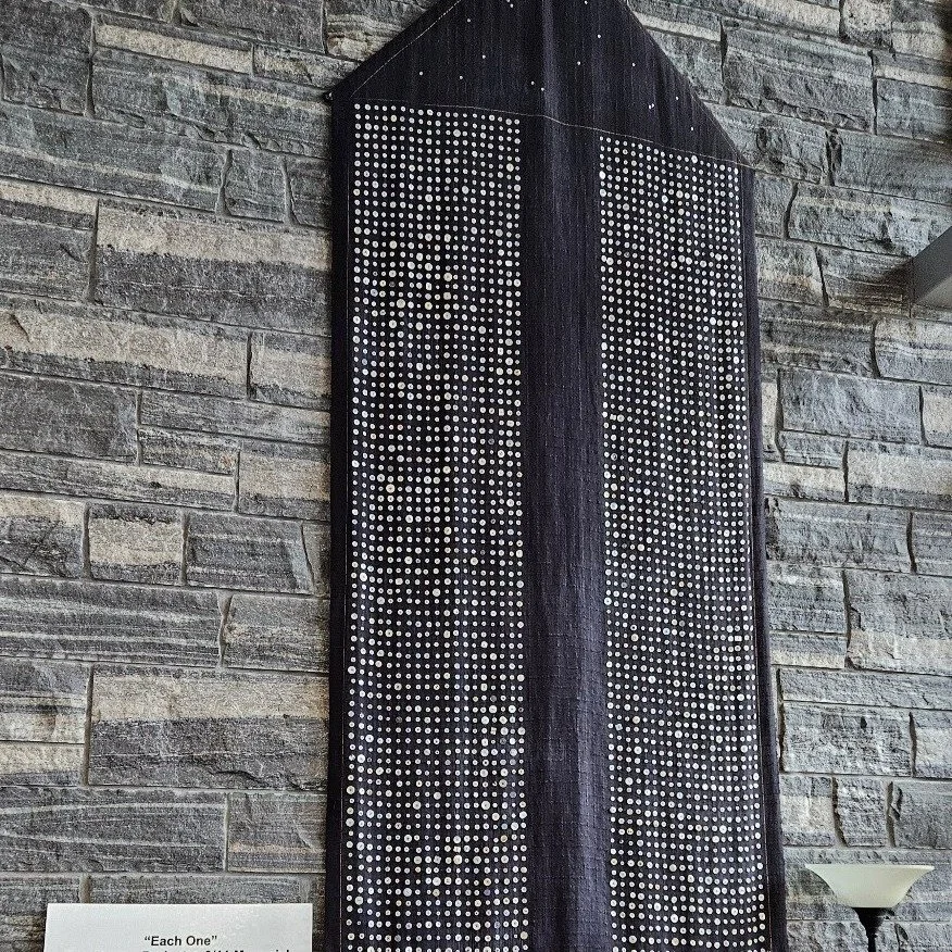 "Each One: The Button Project, a 9/11 Memorial"

Handwoven, hand dyed linen, donated buttons. 9'10" H by 4'2" W Completed 2002

From the beginning this piece was about community. Together we processed grief and shock. Together we 