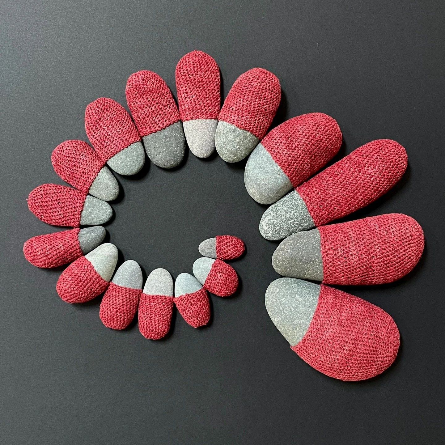 &ldquo;KHARIKLO&rsquo;S WOMB&rdquo;

In naming this series, I honor the transformative power of feminine energy. 
Like a womb, the red crocheted linen wraps these hard, phallic rocks. 

In mythology, Khariklo (also spelled Chariclo, Chariklo) is Chir